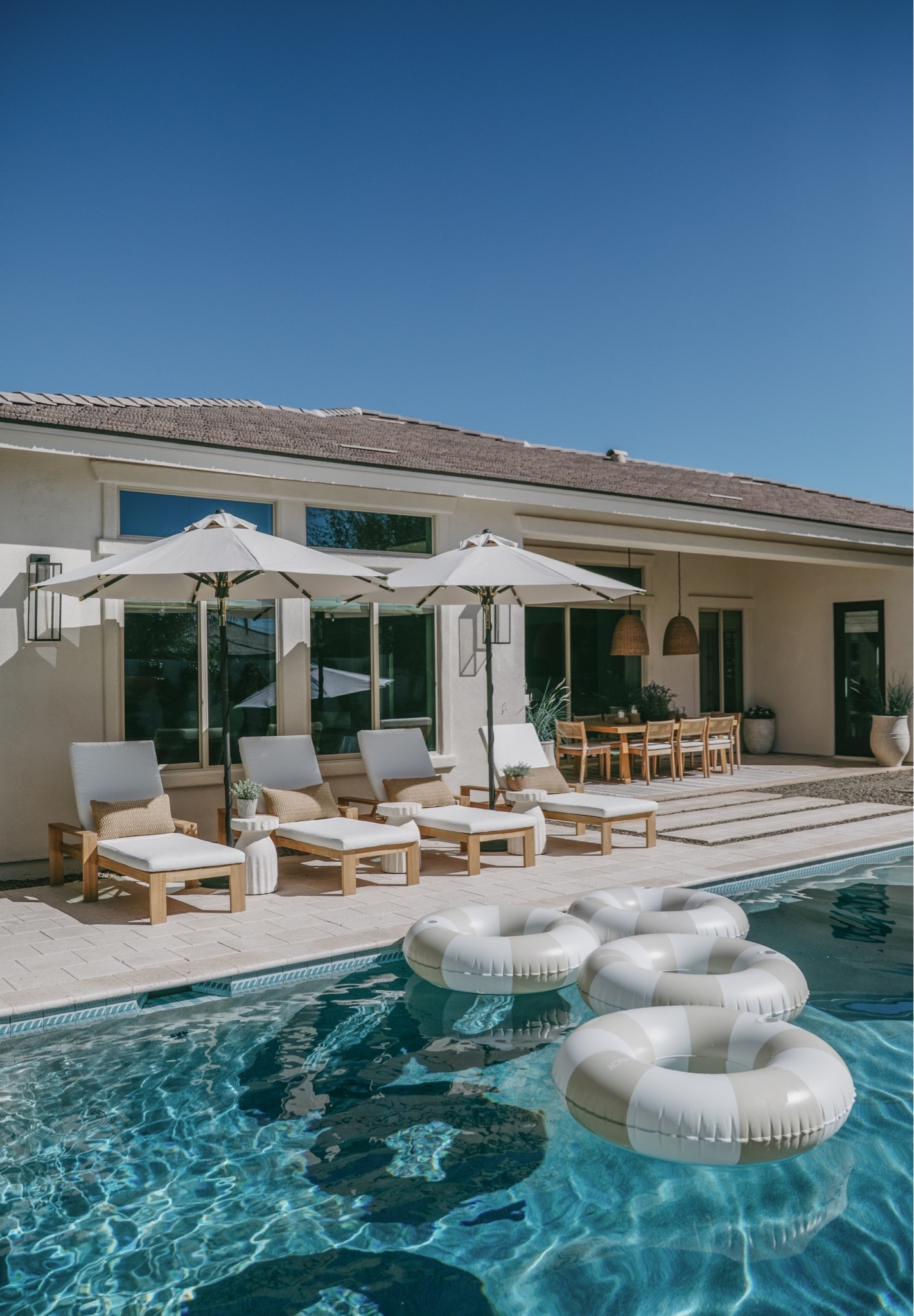 poolside decor, resort style backyard, luxury poolside setup, pool loungers, outdoor chaise lounges, resort inspired outdoor living, poolside umbrellas, backyard oasis, high end outdoor furniture, Mediterranean poolside design, modern organic outdoor style, luxury backyard inspiration, neutral outdoor decor, poolside styling ideas, outdoor entertaining space, warm earthy outdoor tones, teak loungers, striped umbrellas, elevated backyard design, cozy outdoor retreat, resort vibe at home, summer backyard inspiration, pool deck decor, designer outdoor furniture, elegant poolside living, outdoor relaxation space, timeless outdoor style, luxury patio inspiration, curated backyard aesthetic, indoor outdoor living

#LTKHome