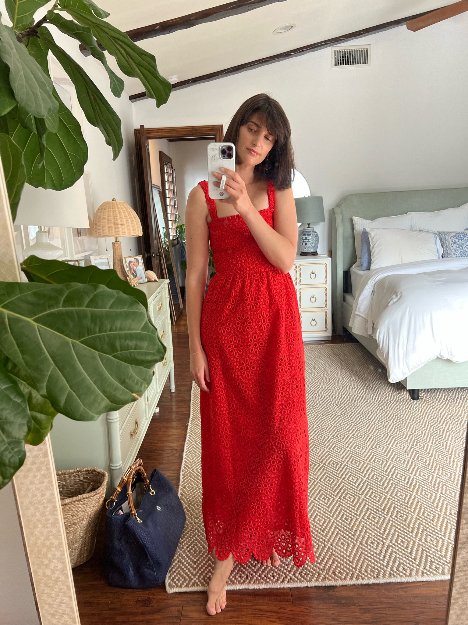 I am OVER THE MOON about this dress. The eyelet detail and that *perfect* shade of red.  Not to mention the incredibly flattering smocked waistline. SWOON! Wearing a small in this one!

#LTKstyletip #LTKFind