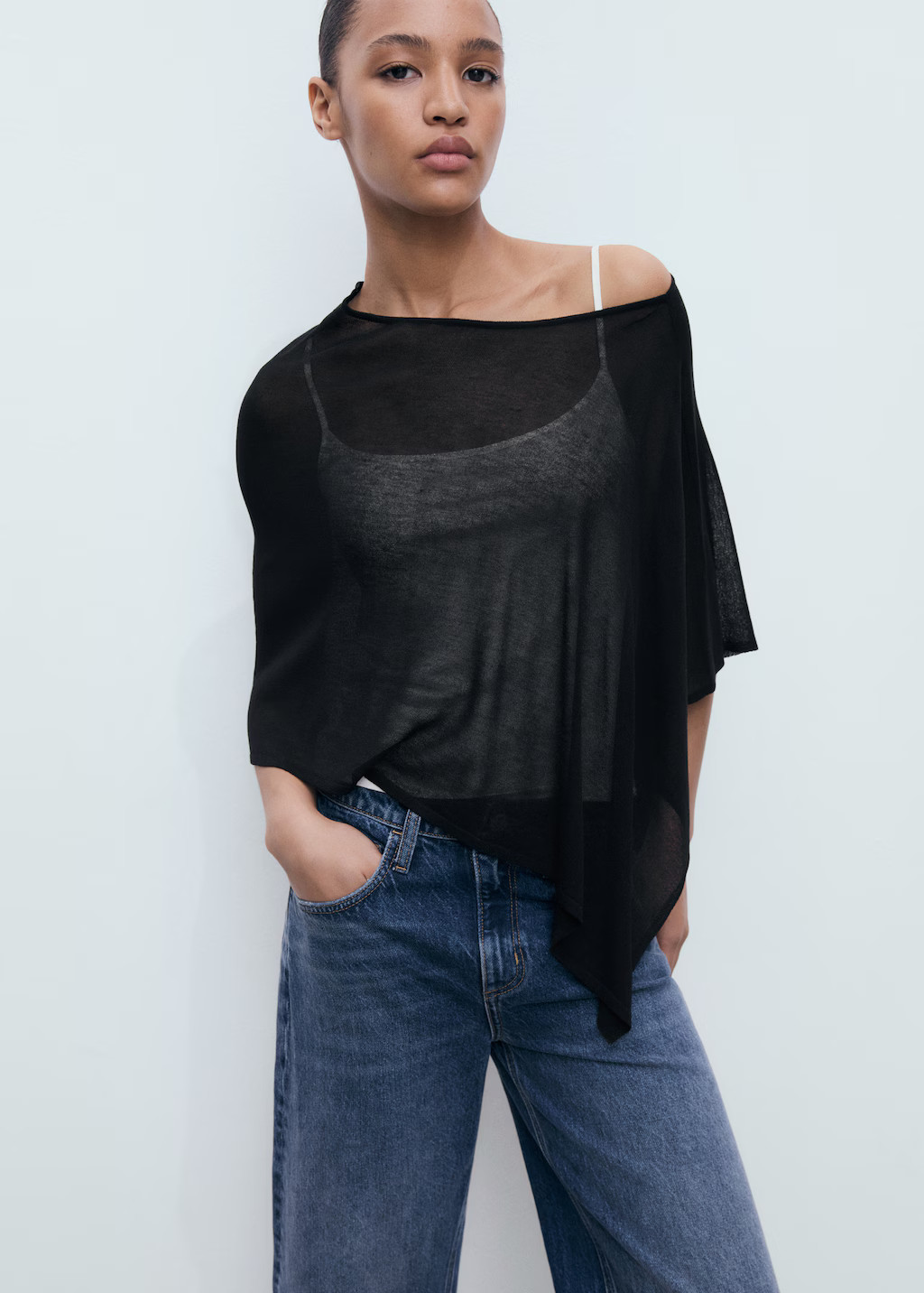 Asymmetrical knitted cape - Women | MANGO United Kingdom | MANGO (UK)