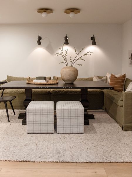 Basement, family room, game room, black dining table, banquette, area rug, jute rug, wall sconce

#LTKhome #LTKstyletip