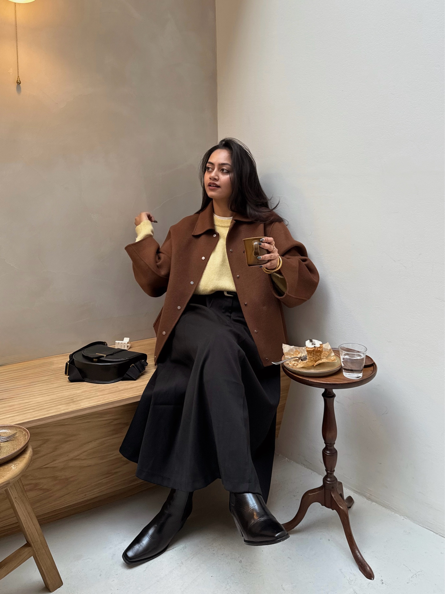 Brown jacket, butter yellow jumper, maxi black skirtt