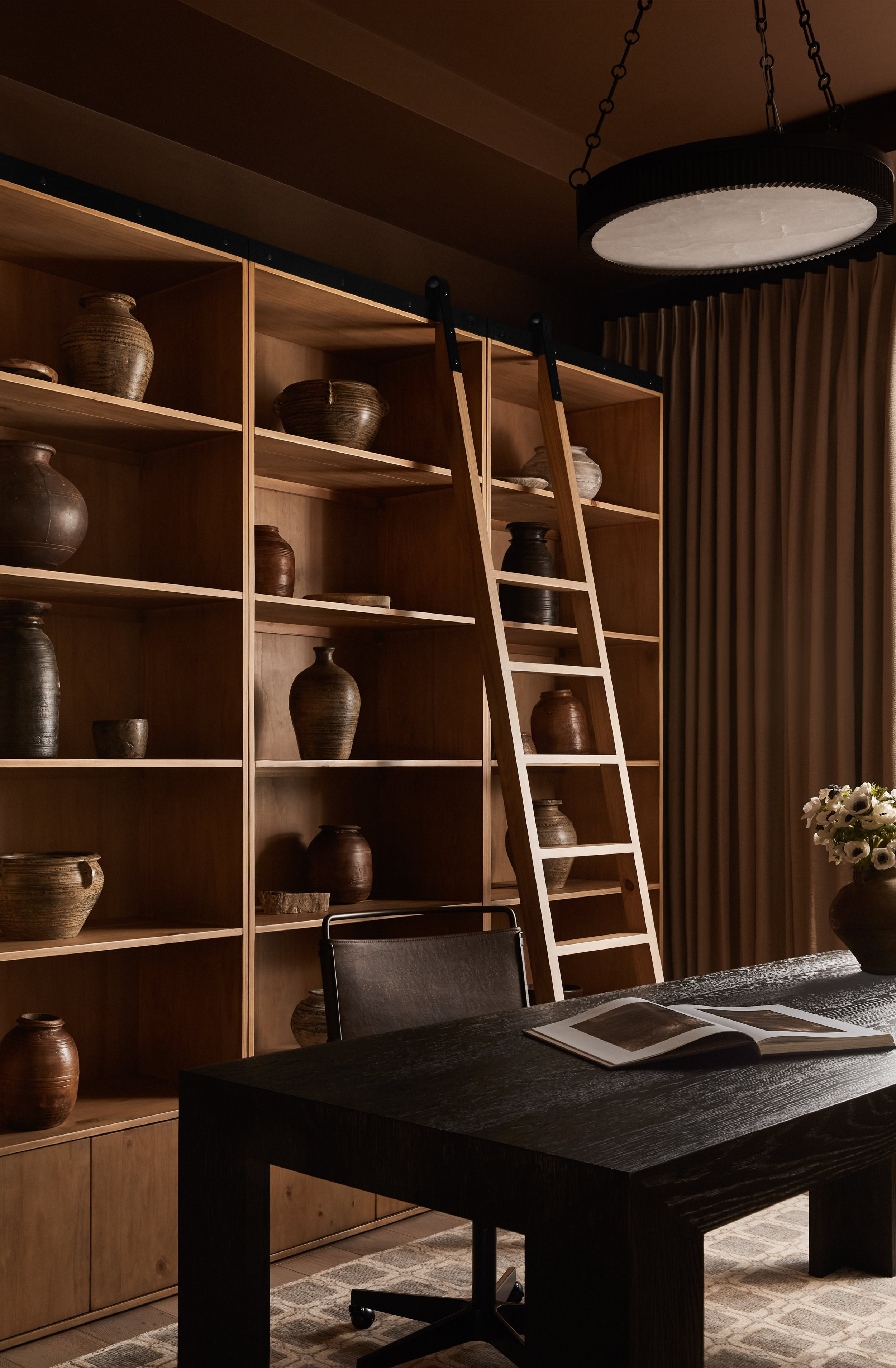 Warm Study with Rich Wooden Shelves 

 #LTKcasa