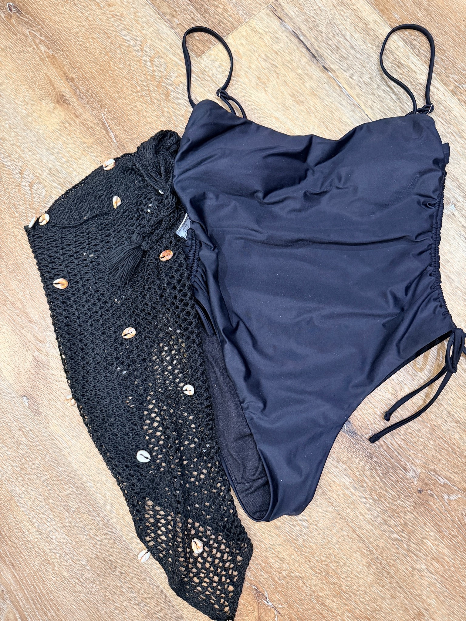 A classic black suit you can never go wrong with. Paired with the seashell sarong, perfect match!

#LTKootd #LTKSeasonal #LTKOver40