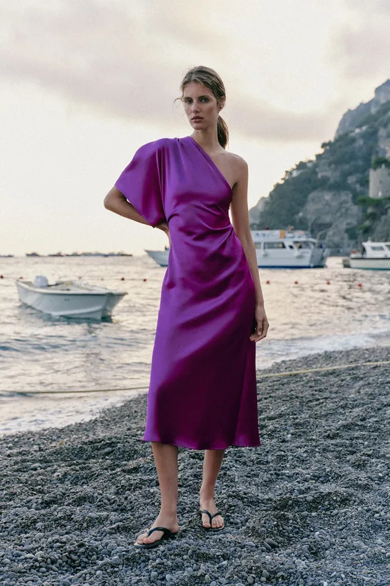 Dress with asymmetric neckline and sleeve. Fitted waist with pleats. Side hidden in-seam zip clos... | Zara US