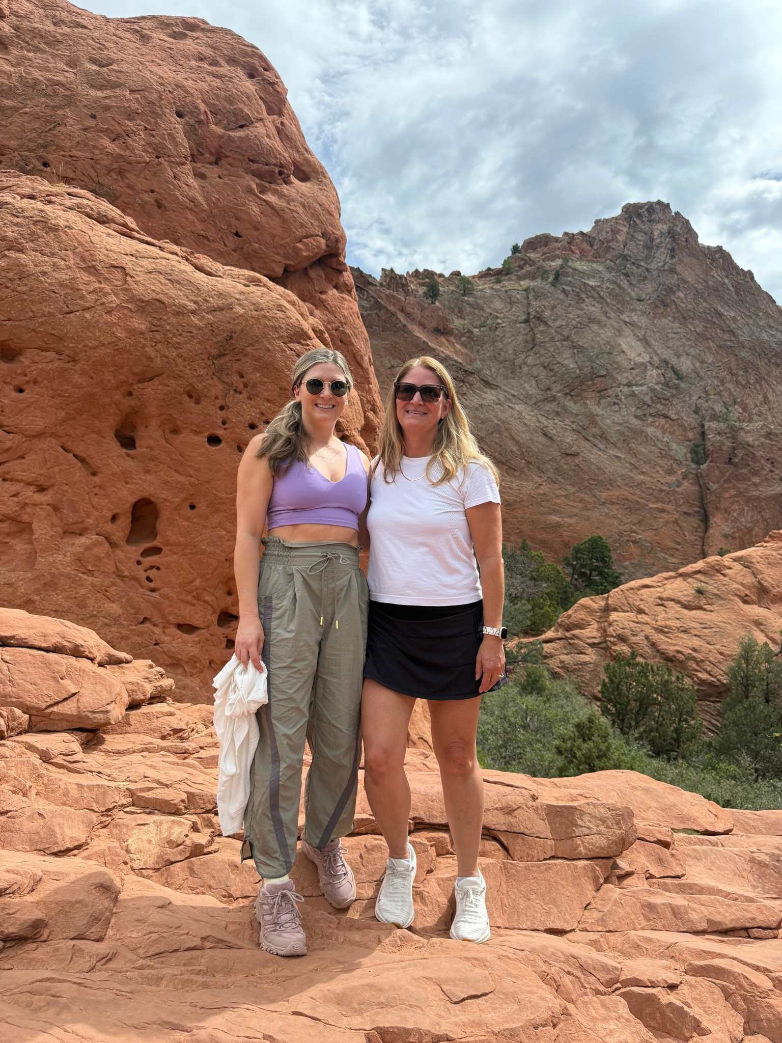 Hiking outfit 
Hiking pants free people lightweight pants 
Ray ban sunglasses 
Lululemon skirt and top 
Hoka shoes 
Hiking shoes Merrell Moab 
