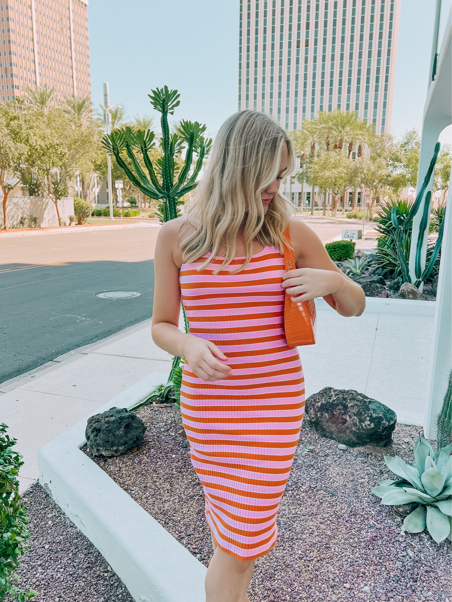 Orange and pink stopped midi dress with orange shoulder bag 


#LTKwedding #LTKstyletip #LTKunder50