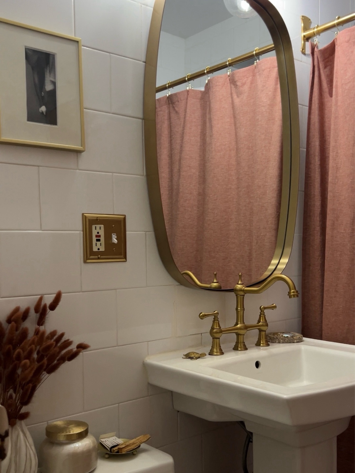 This is my updated tiny Nyc bathroom. With help of my super we’ve changed the hardware to gold brass, knocked down the dated soap dishes, swapped the medicine cabinet for a new mirror, upgraded the switch plates, and almost immediately, you can tell the bathroom looked so much better.

Since I couldn’t paint the walls, I added color through fabrics. I went for Monochromatic terracota them and I added black and white photos to create more interest. And now I think the bathroom looks so cute! 

#LTKhome