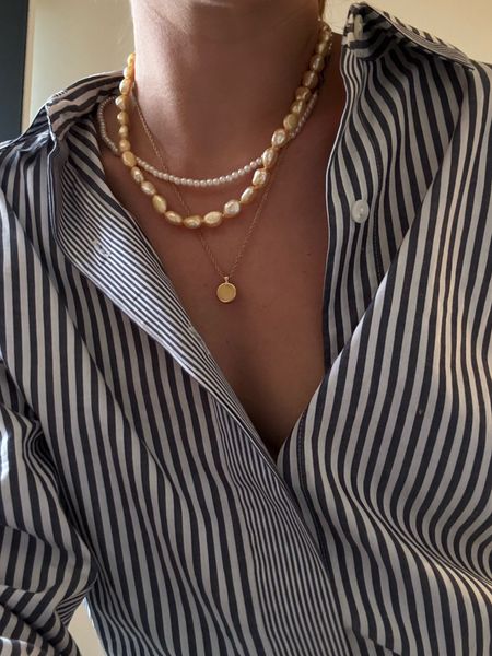 Layering necklaces is a fun way to be creative with your jewelry. Mix golden champagne real sea water pearls with small fresh water pearls and a simple gold chain. Favorites linked below 👇🏻 

#LTKwedding #LTKstyletip #LTKbeauty