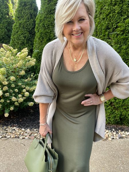 Olive green maxi dress for Fall! Neutral knit cardigan and olive green handbag! Tania Stephens | 50 is not old | gold jewelry | comfy casual style | nude heels | teacher outfit | work style 

#LTKworkwear #LTKstyletip #LTKSeasonal