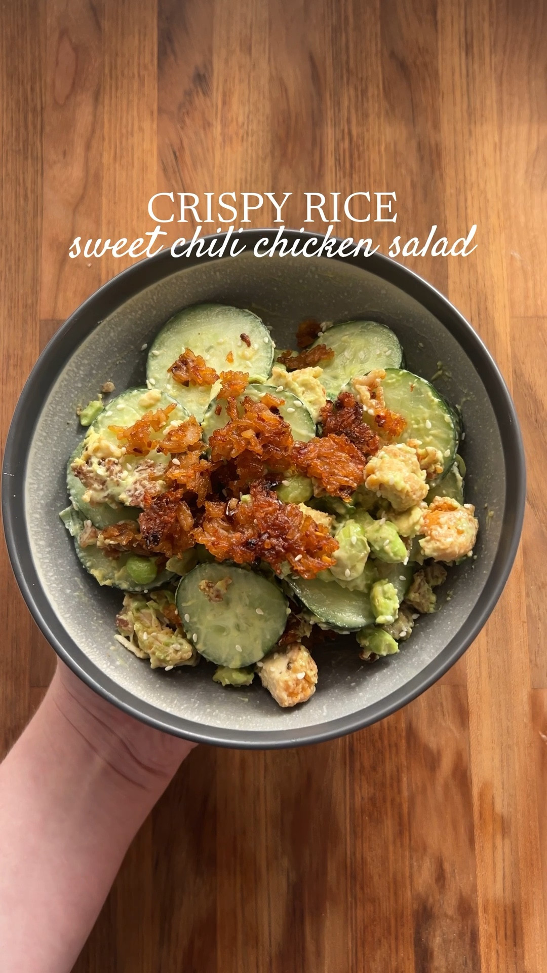 making the viral sweet chili chicken crispy rice salad 🥗 OMG this was so good, 10/10 highly recommend! I used lightly breaded chicken chunks for this. 440 cal, 10g protein, 10g fiber. Makes 6 servings.

You’ll need 1-2 cucumbers, 1 bag edamame, 1/4 cup chopped green onion, 2 avocado cubed. Cook 1/2c white rice, cool and stir in 1tbsp sesame oil, 2 tbsp soy sauce, 1 tbsp chili oil. Spread on baking sheet and bake at 400 degrees Fahrenheit for approximately 40 min, flip every so often. Keep and eye on it, every oven is different. Dressing is 1/4c nonfat Greek yogurt, 1/4c mayo, 1/4c sweet chili sauce, 1/2tsp paprika, 1/2tsp garlic powder, pinch of salt and lime juice. Assemble and enjoy. 

Recipe is from @noaawilliams_ on TikTok, tweaked slightly for my liking! 

#LTKfitnessgoals #LTKActive #LTKfoodie
