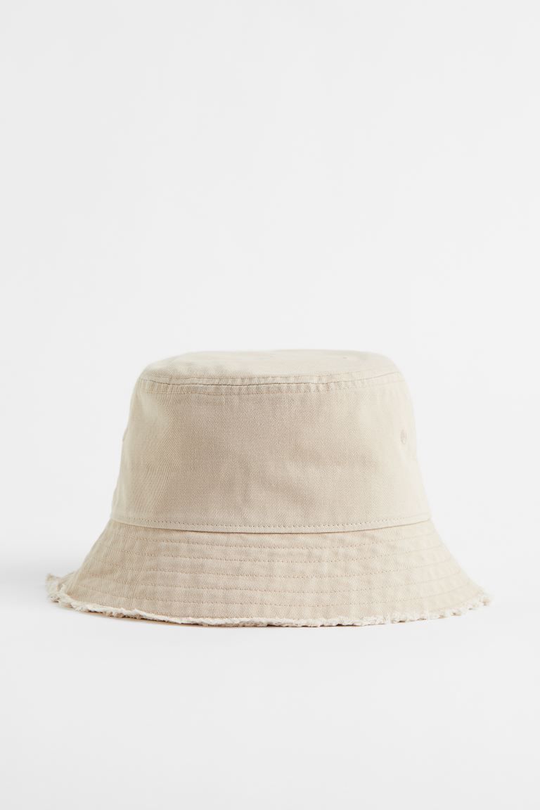 New ArrivalBucket hat in cotton twill with embroidered eyelets and sloped brim. Lined.Composition... | H&M (US)