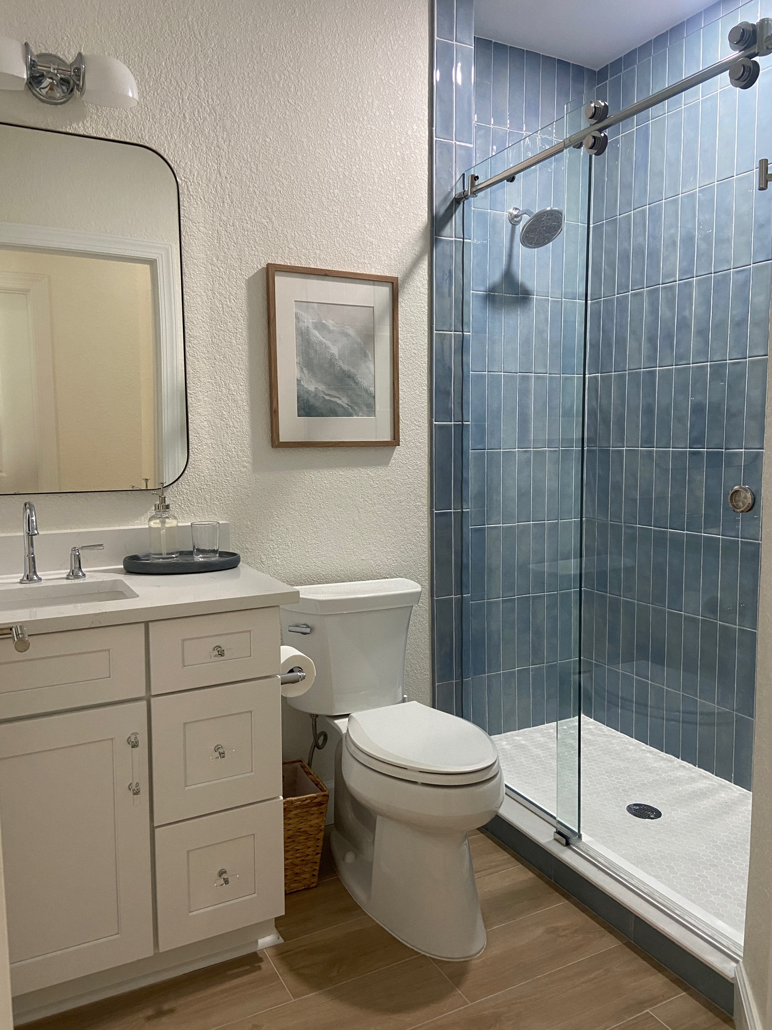 Love this coastal bathroom with a fun blue tile! 

#LTKHome #LTKSaleAlert