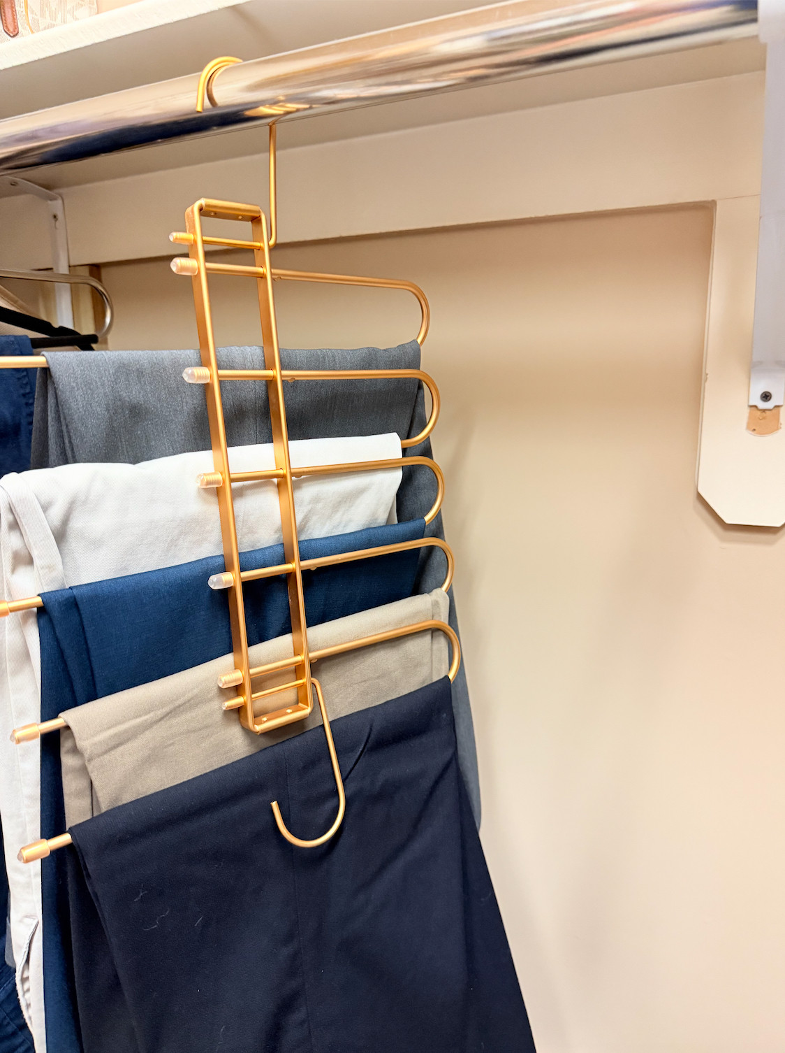 Maximizing closet space with these multi-tier gold hangers. They are such a chic, space-saving solution for keeping pants organized and wrinkle-free while streamlining your morning routine. 

 #LTKdayinmylife #LTKmomlife #LTKHome
