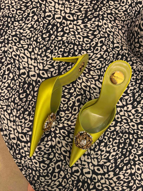 Chartreuse satin, jeweled toe, that little gold medallion peeking out the back — this is the kind of shoe that makes an outfit an event. YSL doesn't miss.

Linking similar below because let's be honest, we're not all dropping YSL money on a Tuesday. 🐆✨ 

 