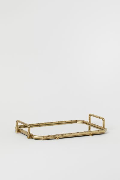 Metal tray with a frame, bamboo-stem-shaped handles, and mirrored base. Padding underneath with f... | H&M (US + CA)