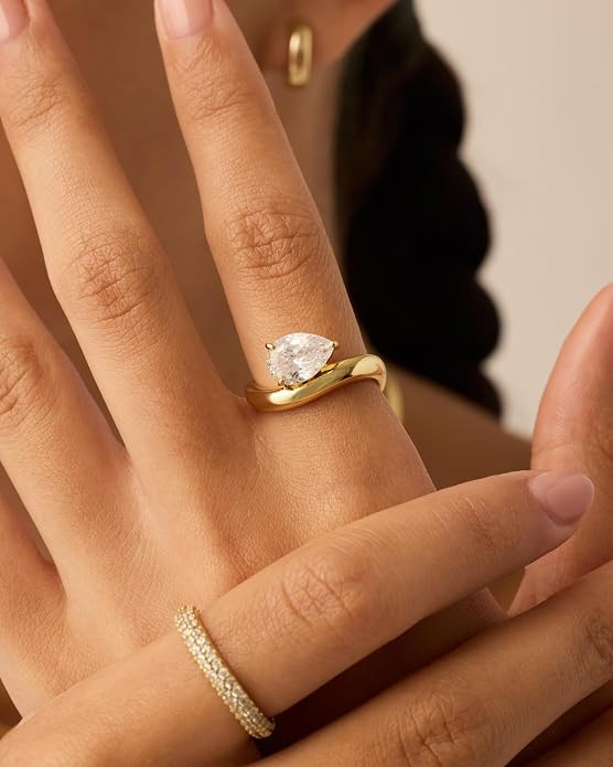 PAVOI 14K Gold Plated Wavy Engagement Ring for Women | Solitaire Cubic Zirconia Wedding Band & Pr... | Amazon (US)