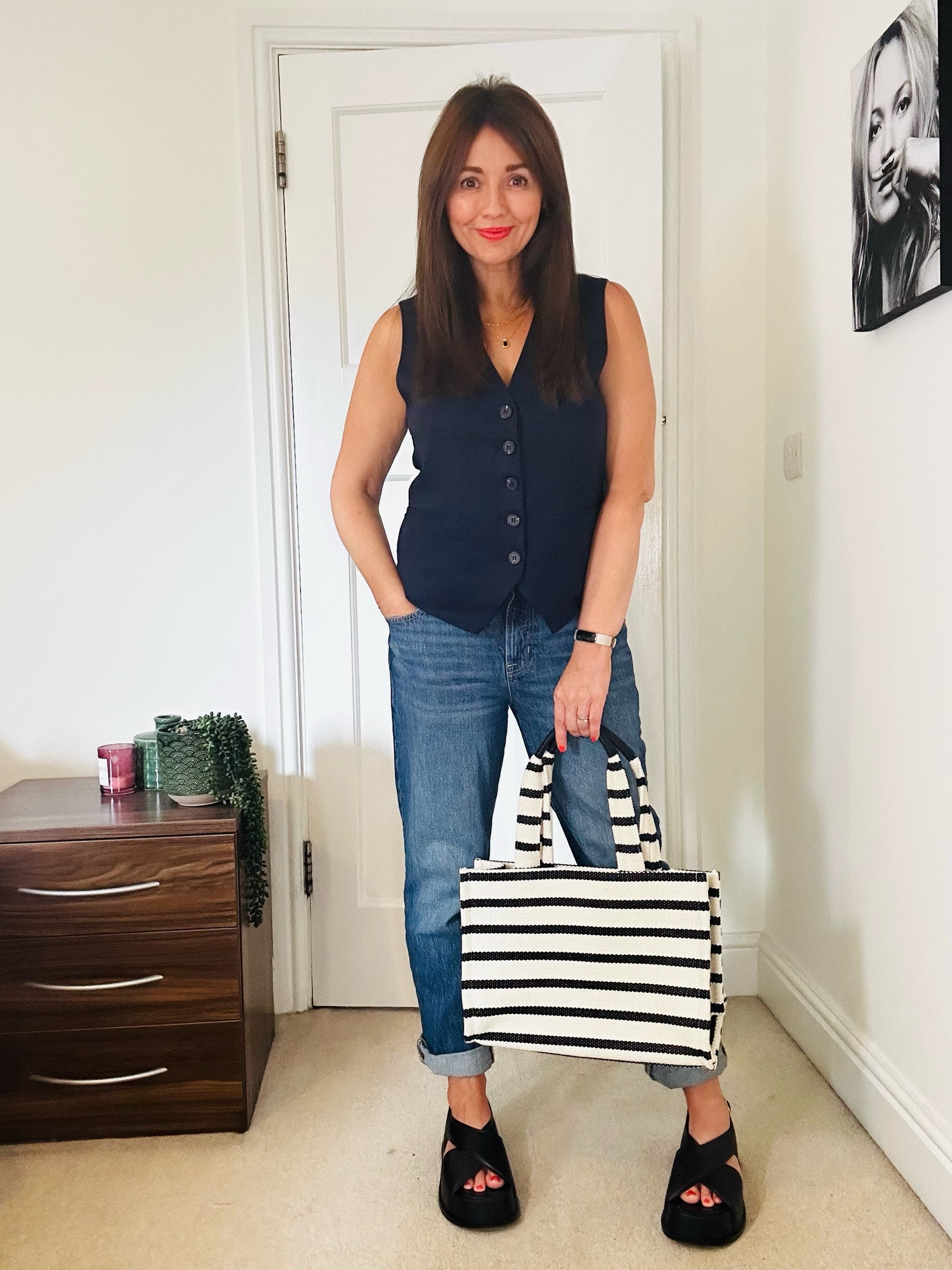 Love these jeans, and bag with this simple navy waistcoat. Easy to wear for cooler days.

#LTKeurope #LTKhome #LTKfamily