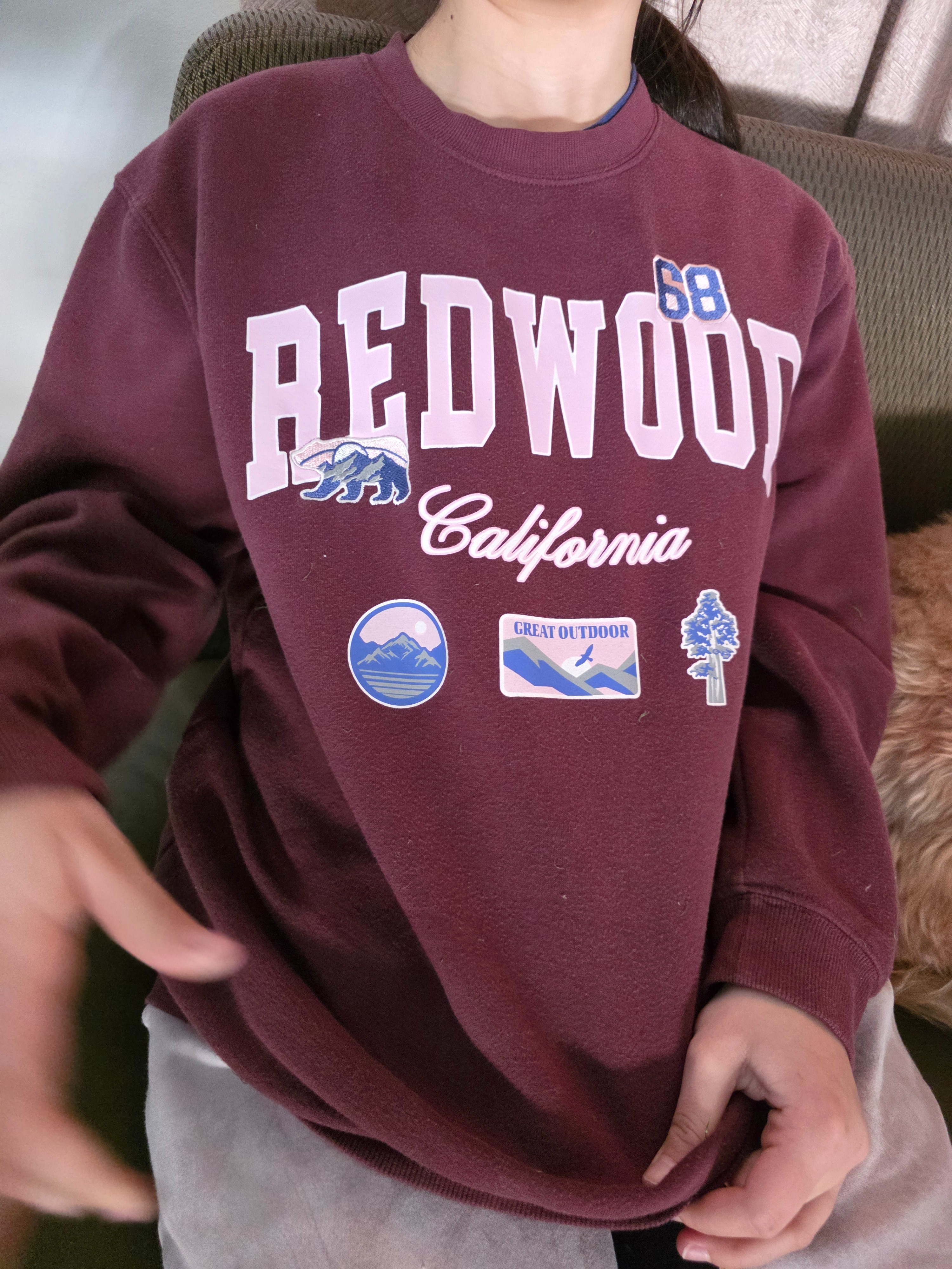 I officially won the "cool mom" award with this gift! I grabbed this Redwood California sweatshirt for my daughter, and she’s obsessed. Usually, graphic pullovers can be hit or miss on quality, but this one is incredibly soft and thick—the kind of cozy fleece that actually lasts.
​The deep plum color and the unique patch details give it such a high-end vintage aesthetic. She’s wearing a size Medium here for that perfect, effortless oversized fit. If you’re looking for a quality gift that they’ll actually wear every day, this is a 10/10.
​Shop her exact look below! 🌲✨
​
​
​
​
​
​ 

 #oversizedsweatshirt #nationalparkstyle #granolagirl #giftideasforher #vintageaesthetic #teengiftideas #LTKootd #LTKmomlife #LTKKids