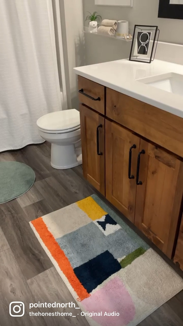 Fun details in Emmett’s bathroom. The West Elm rug is currently under $40 & all Society6 art prints are 30% off! I highly recommend ordering them framed. Such great quality & you can hang it right away. 🙌🏻 #bathroom #homedecor #kidsbathroom #bathmat #bathroomrug #artprints #modernart #framedart #colorfulart #home #ltkunder50 

#LTKsalealert #LTKkids #LTKhome