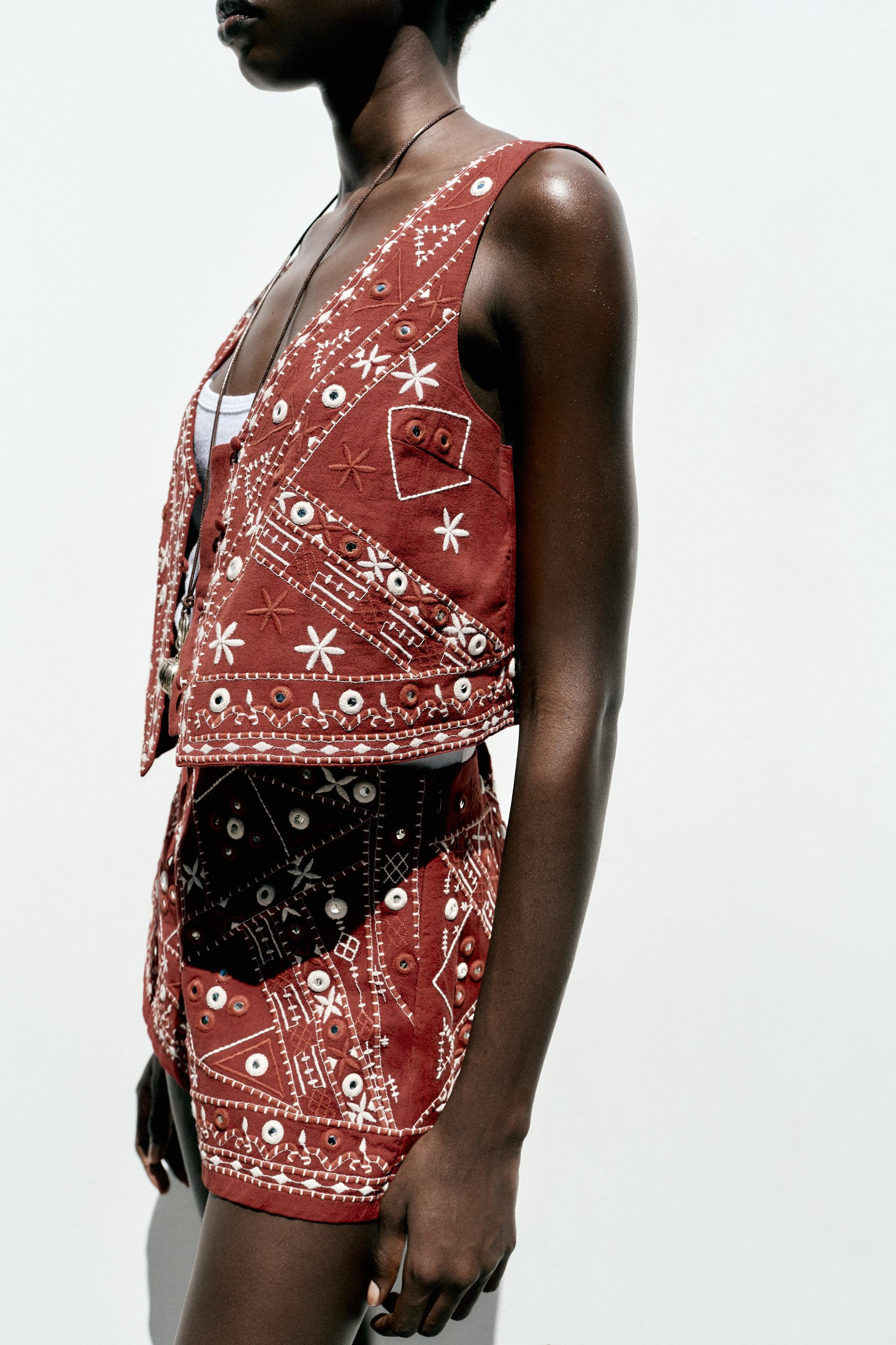 V-neck vest with sleeveless design. Features embroidery and mirror details. Front closure with ma... | Zara US