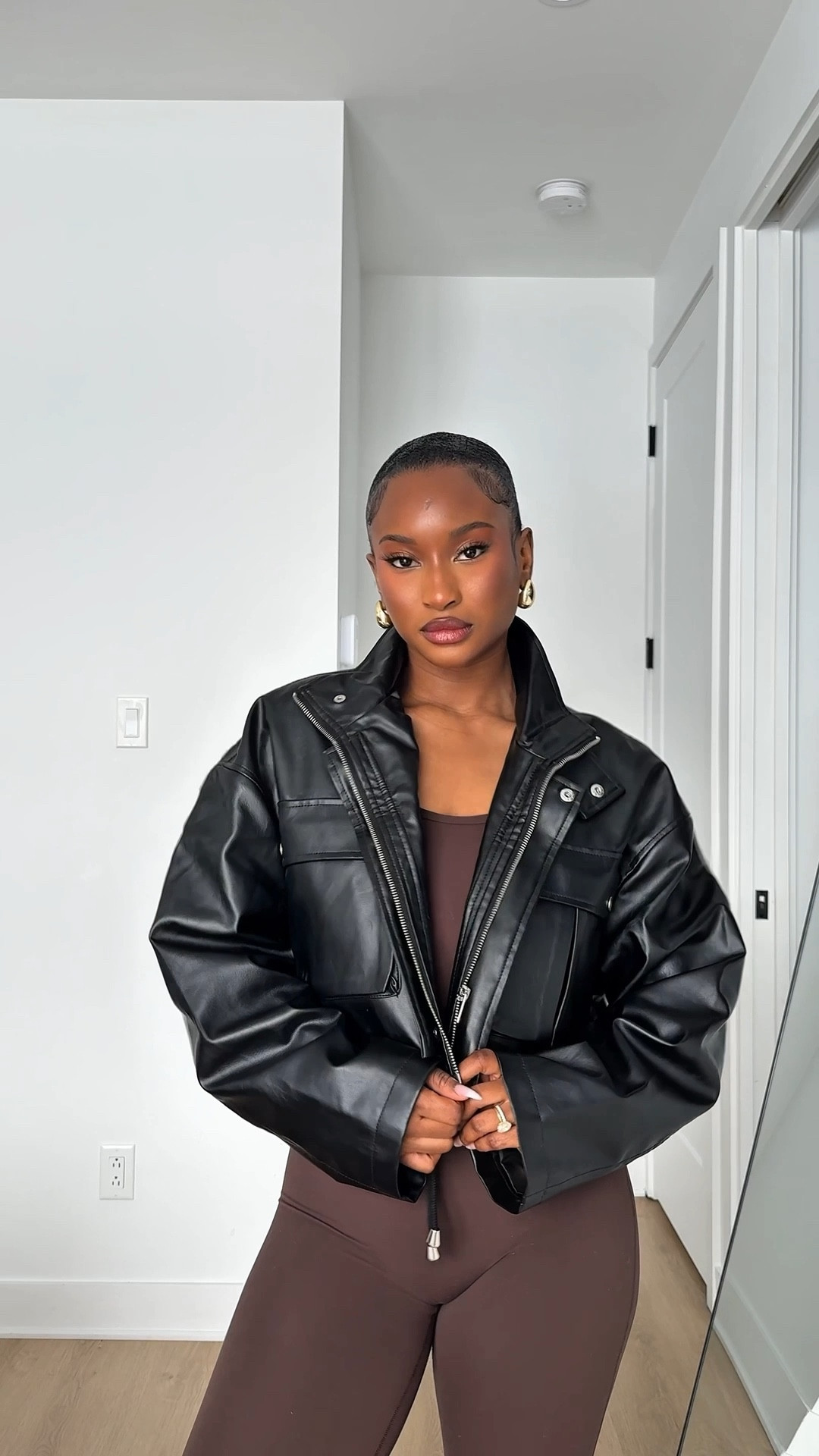 Love this black cropped leather jacket! The unique style and fit makes it so perfect for Spring! And this Aritzia brown jumpsuit is everything! 

#LTKSpringSale #LTKStyleTip