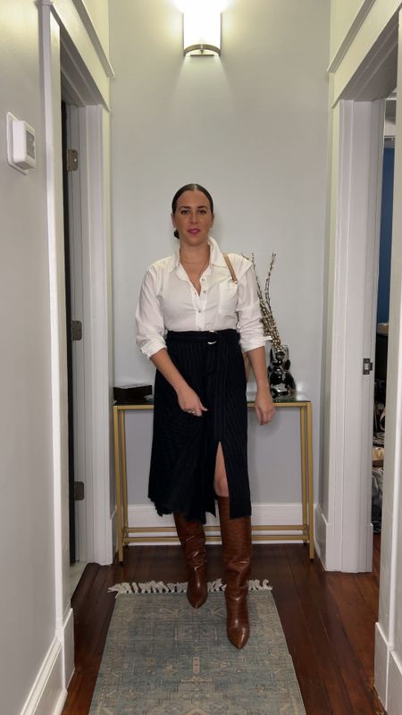Work outfit. Long pleated skirt. White button down. Rent the runway. Tall brown boots. Office style.

#LTKVideo #LTKfindsunder50 #LTKworkwear