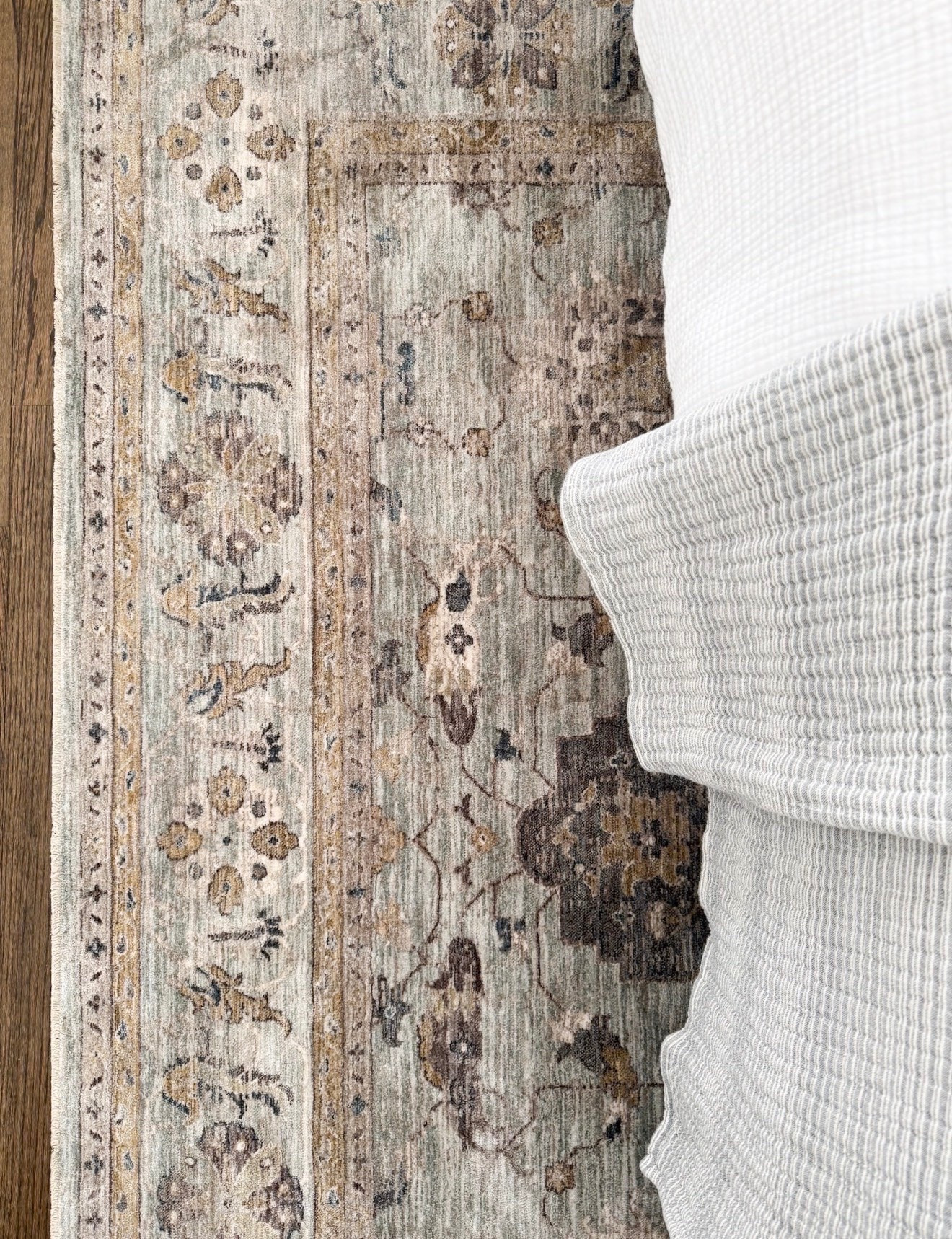 The soft, faded pattern on this rug adds so much depth to the bedroom without overpowering it. The mix of muted blue, taupe, cream, and warm brown gives it that collected, lived-in look that works beautifully with crisp white bedding.

vintage inspired rug, bedroom area rug, neutral patterned rug, muted blue rug, traditional rug, bedroom decor, neutral bedroom, vintage style rug, layered home decor, classic interiors, girlonthehudson

#LTKHome #LTKSeasonal