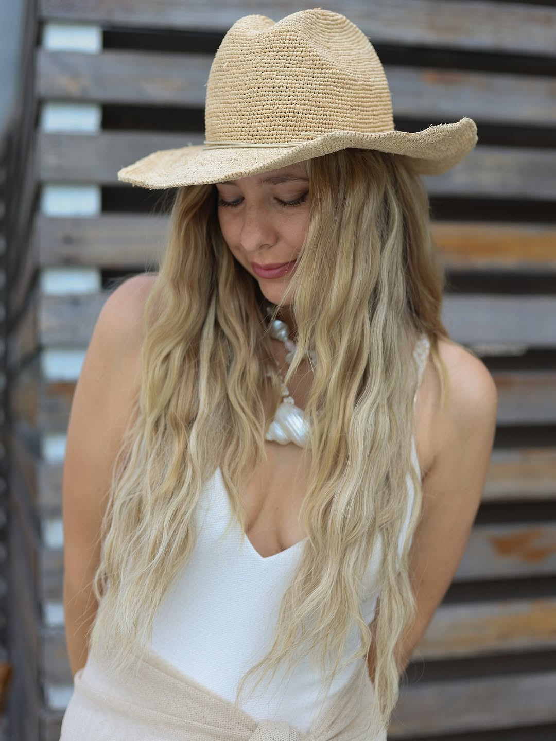Sun-kissed style. This coastal look features a white V-neck swimsuit paired with a wide-brim straw fedora and a statement seashell pendant necklace. #SummerHat #BeachVibes #LTKswim 

 #LTKdayinmylife #LTKgrwm #LTKootd