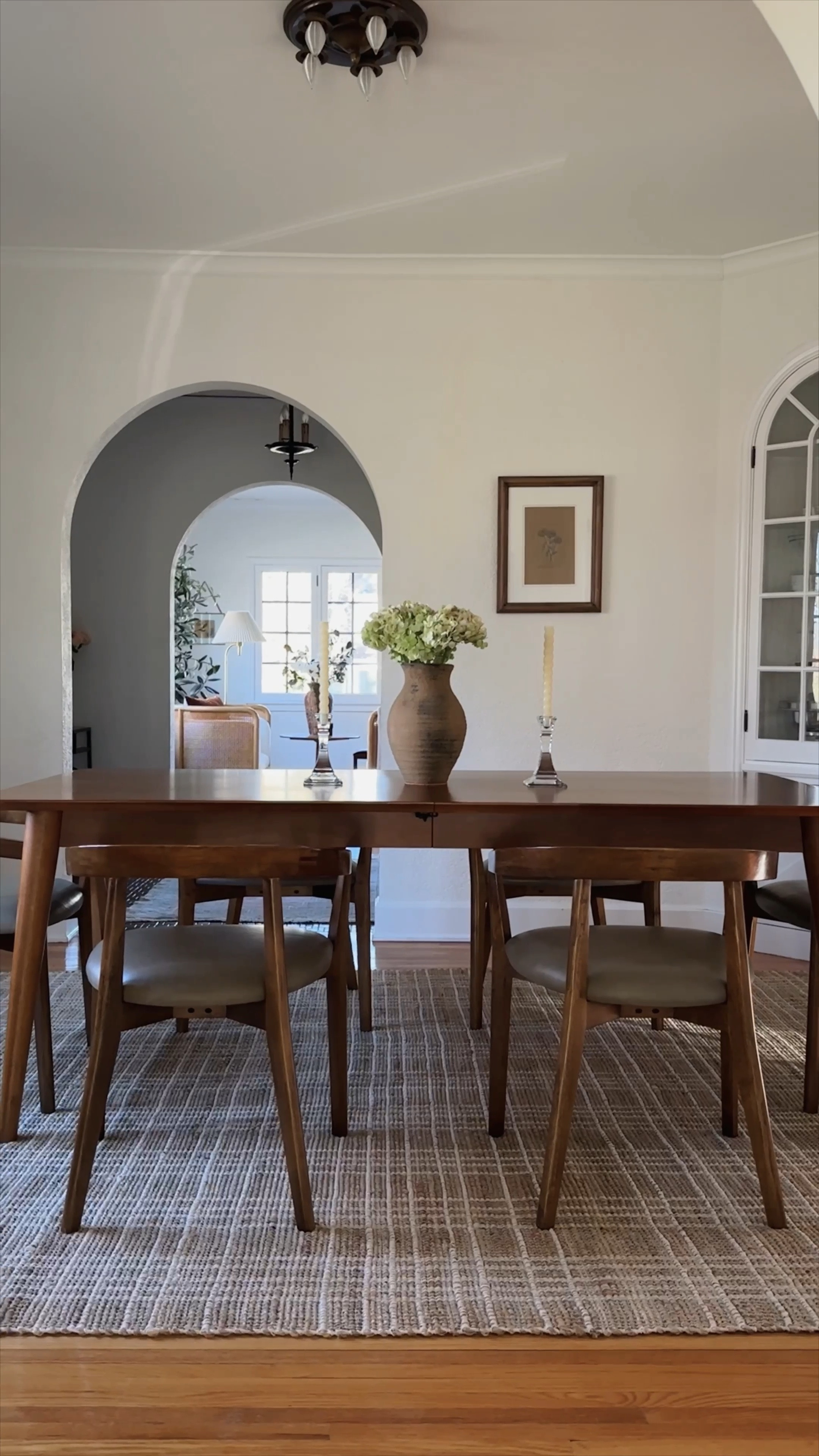 Tried out a new rug that was meant to be for another room but think it will now stay here in our dining room. Love this handwoven natural fiber rug. It’s kid and pet friendly, easy to blot away stains and great for high traffic areas. Besides the practicality, the pattern really pops through in this space.  *rugs (on sale!), rug pad, pleated curtains, curtain rings, dining table and chairs, clay vase, wall candleholder, wipeable mat which I highly recommend under a kids chair. 

#LTKhome #LTKstyletip #LTKsalealert