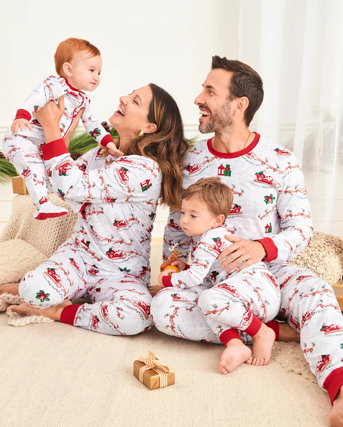 Our Santa's Sleigh Collection features matching pajamas for the whole family. | The Children's Place