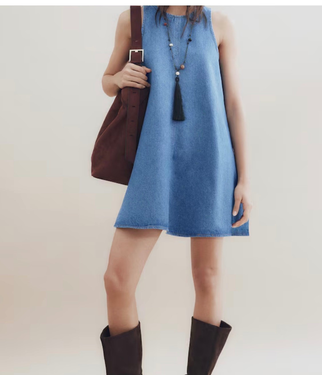 Take a look at this casual denim.dress and pair with brown high-top  boots and a brown purse

#LTKootd #LTKSeasonal #LTKSpringSale