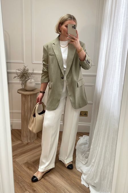 Sage green blazer (size s) 
Cream tailored silk trousers 
White cos tee (size S) 
Ballet pumps 