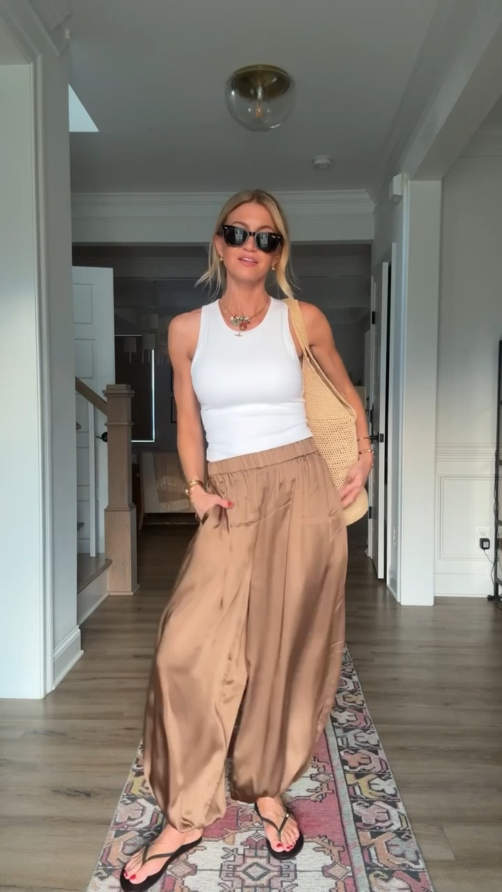 My bronze balloon pants just went on sale! 

White tank: has a built in bra: TTS, wearing a S
Bronze silk balloon pants: TTS, wearing XS
Black sandals: runs slightly small, size up if in between sizes

#LTKootd #LTKgrwm #LTKSeasonal
