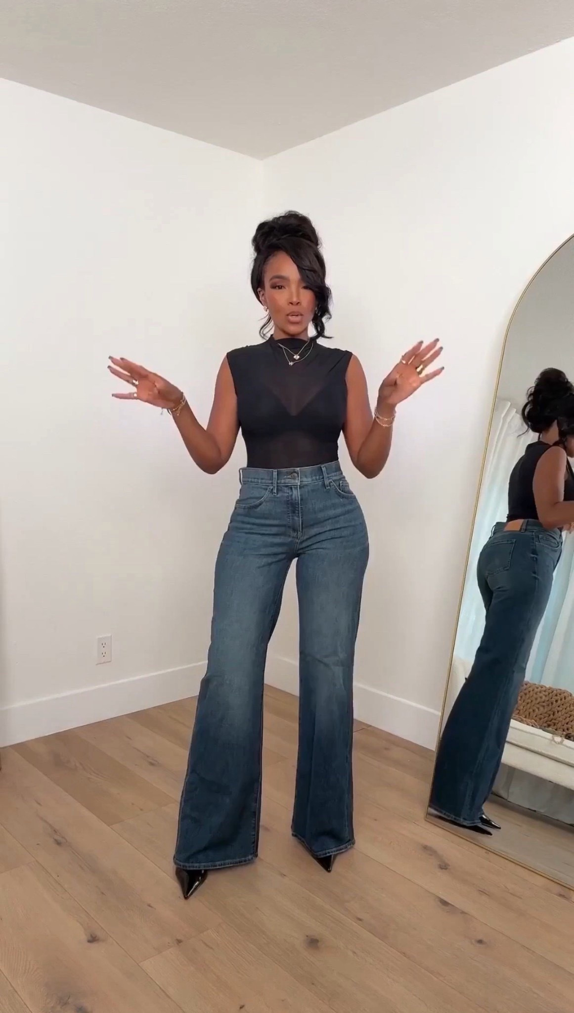 A sleek, modern base look — the sheer mock-neck top adds just the right amount of edge while the structured wide-leg denim balances everything with a clean, elongated silhouette. Effortless, elevated, and perfect for styling up or down all season.

Perfect for: dinner nights, casual events, elevated weekend looks

📏 Sizing: Small top, 27 Long jeans  
Height — 5’4”  
138 lbs  
Bust — 34D  
Waist — 27”  
Hips — 40”

Tap to get details instantly.

mock neck sheer top outfit, wide leg denim styling, elevated basics, chic casual outfit ideas, minimalist black top looks

Follow me on Instagram and YouTube @kirasfashionfinds