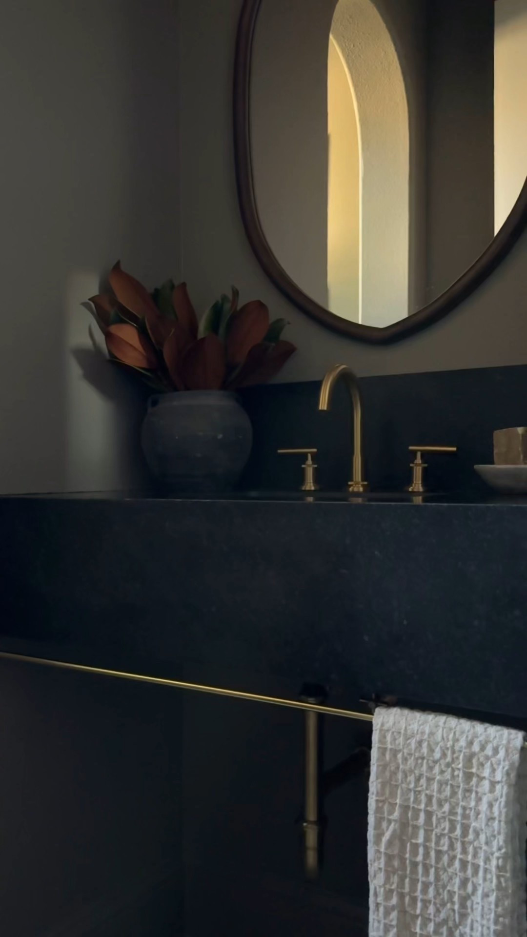 Moody powder room makeover!

I love how the brass faucet and brass bathroom vanity light balance out the dark wood mirror 🤎✨



#LTKHome