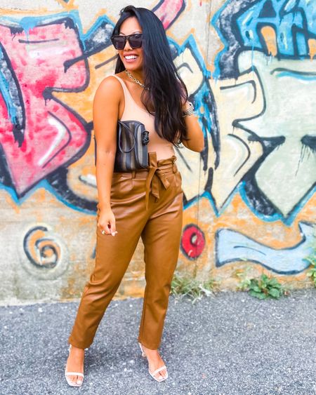 Fall transition #ootd. Paired this tank body suit with my vegan leather pants. Loving the camel colored tone. So chic and perfectly pairs with gold jewelry. 

#LTKstyletip #LTKunder50 #LTKunder100