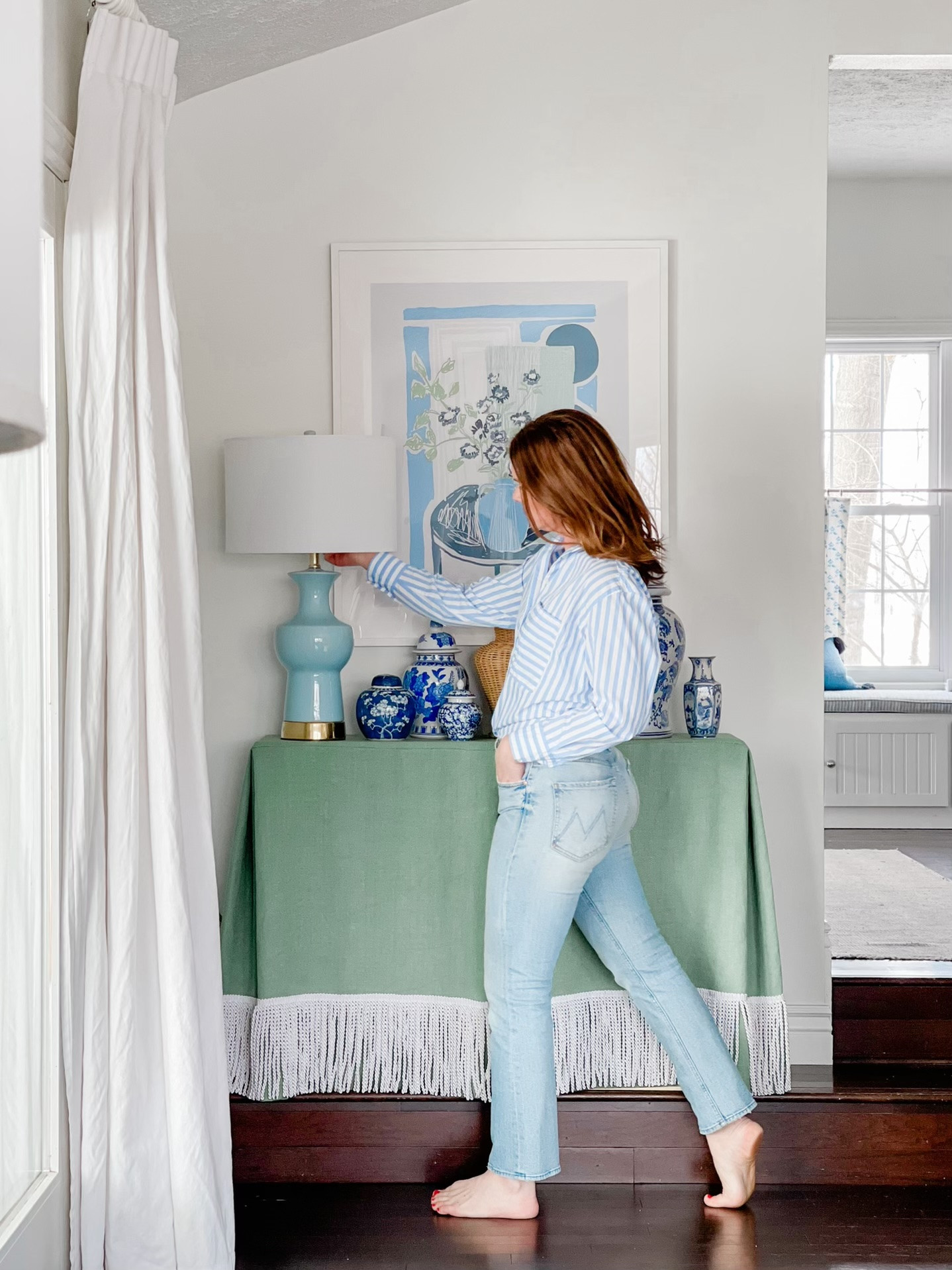 Blue and green interiors will always win my heart. Here are details on the fabric and trim I used to skirt this small console table.  

 