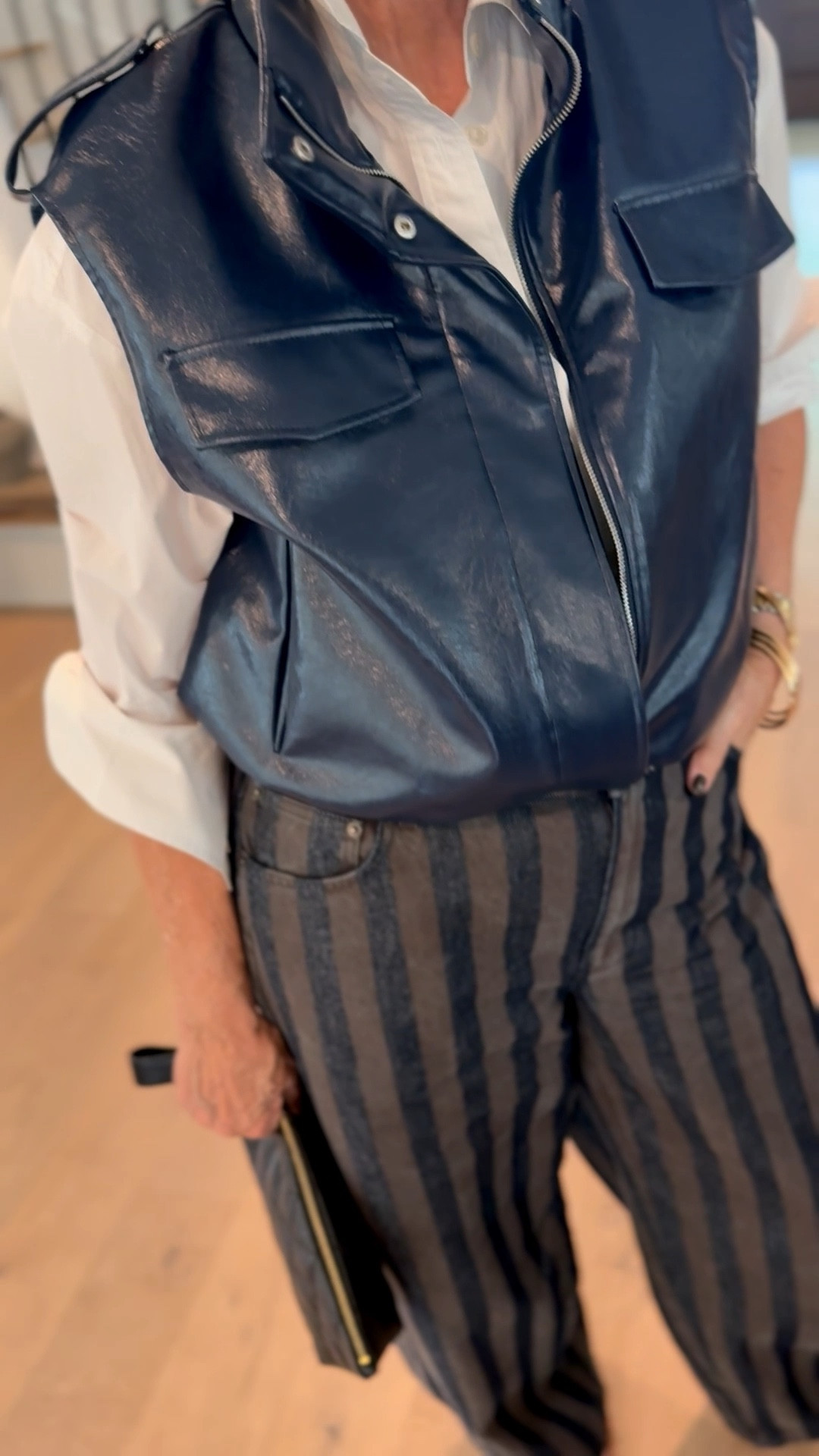 faux leather navy vest // striped pants 

#LTKOver40 #LTKgrwm
