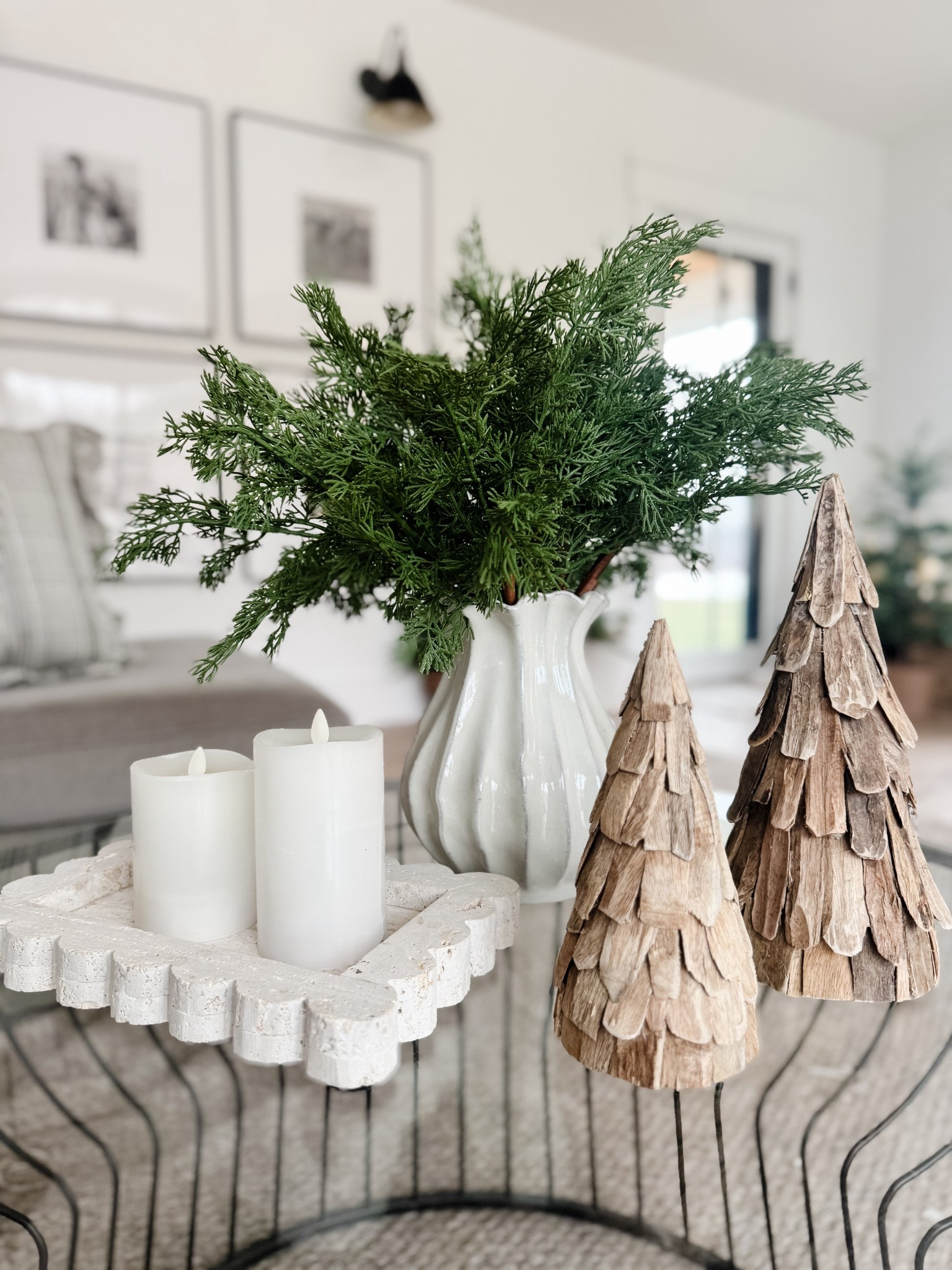 Coffee table holiday decor 
Cedar stems 
Trees
Luminara candle
Marble trays 

#LTKSeasonal #LTKHome #LTKHoliday