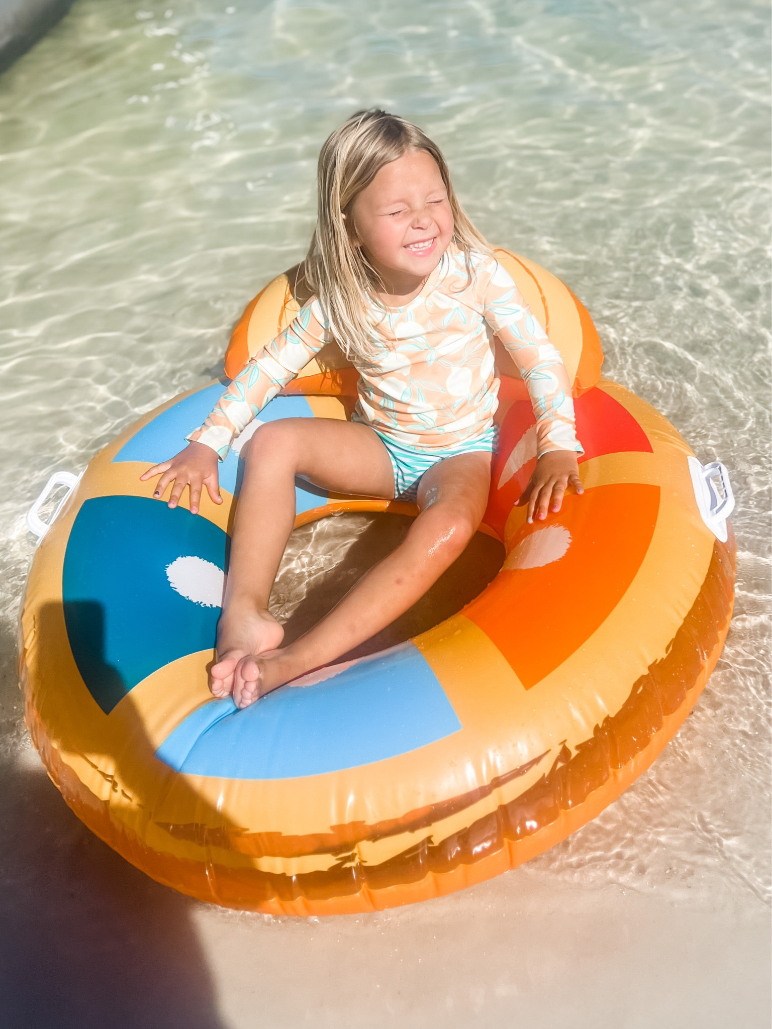 Toddler Swimsuit from @target. The rash guard top is perfect & such a cute print. 