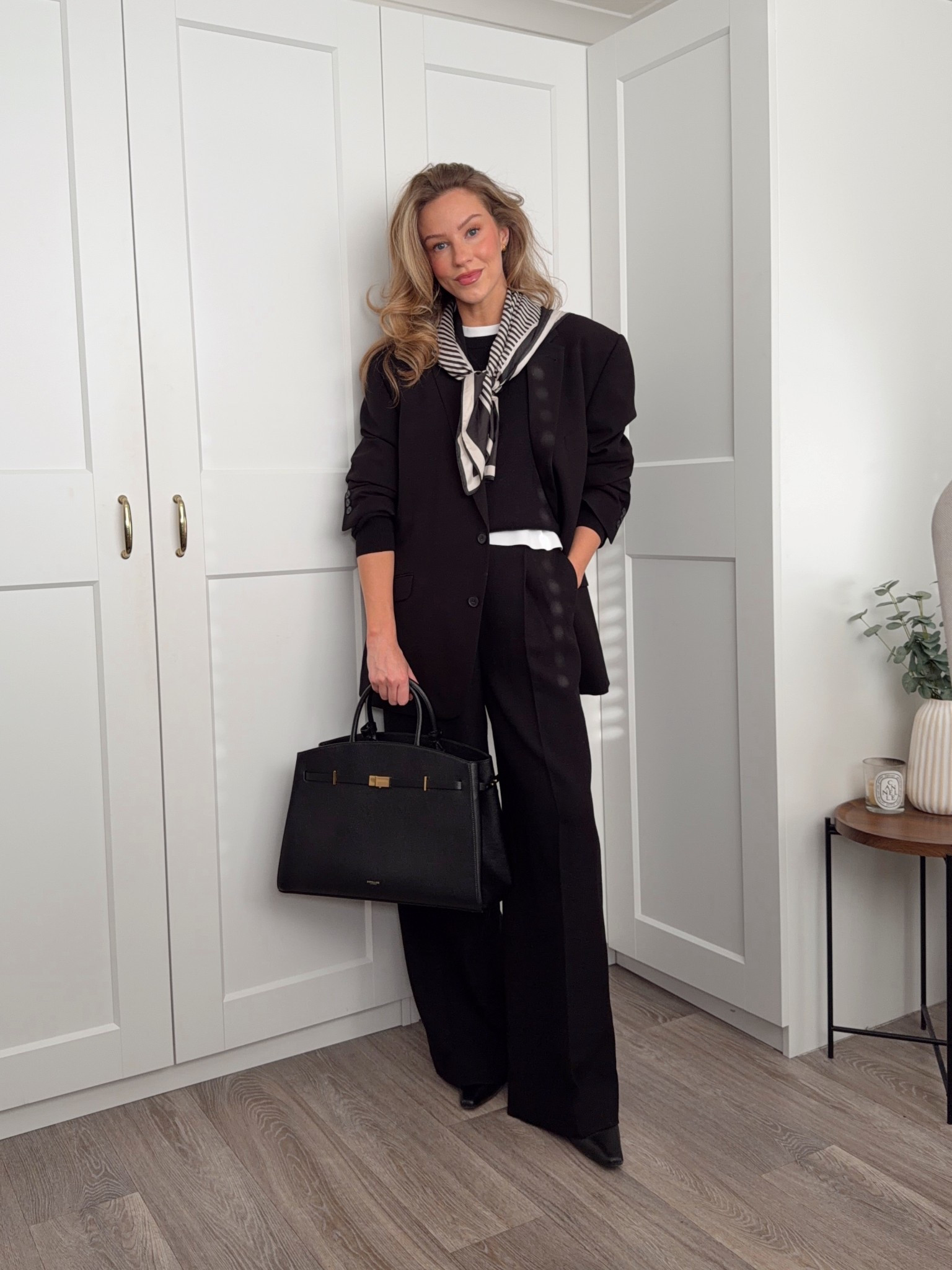 Winter workwear, black tailored trousers, black knit jumper, white tshirt, demellier Hudson bag, heel ankle boots 

#LTKwinter #LTKuk #LTKworkwear