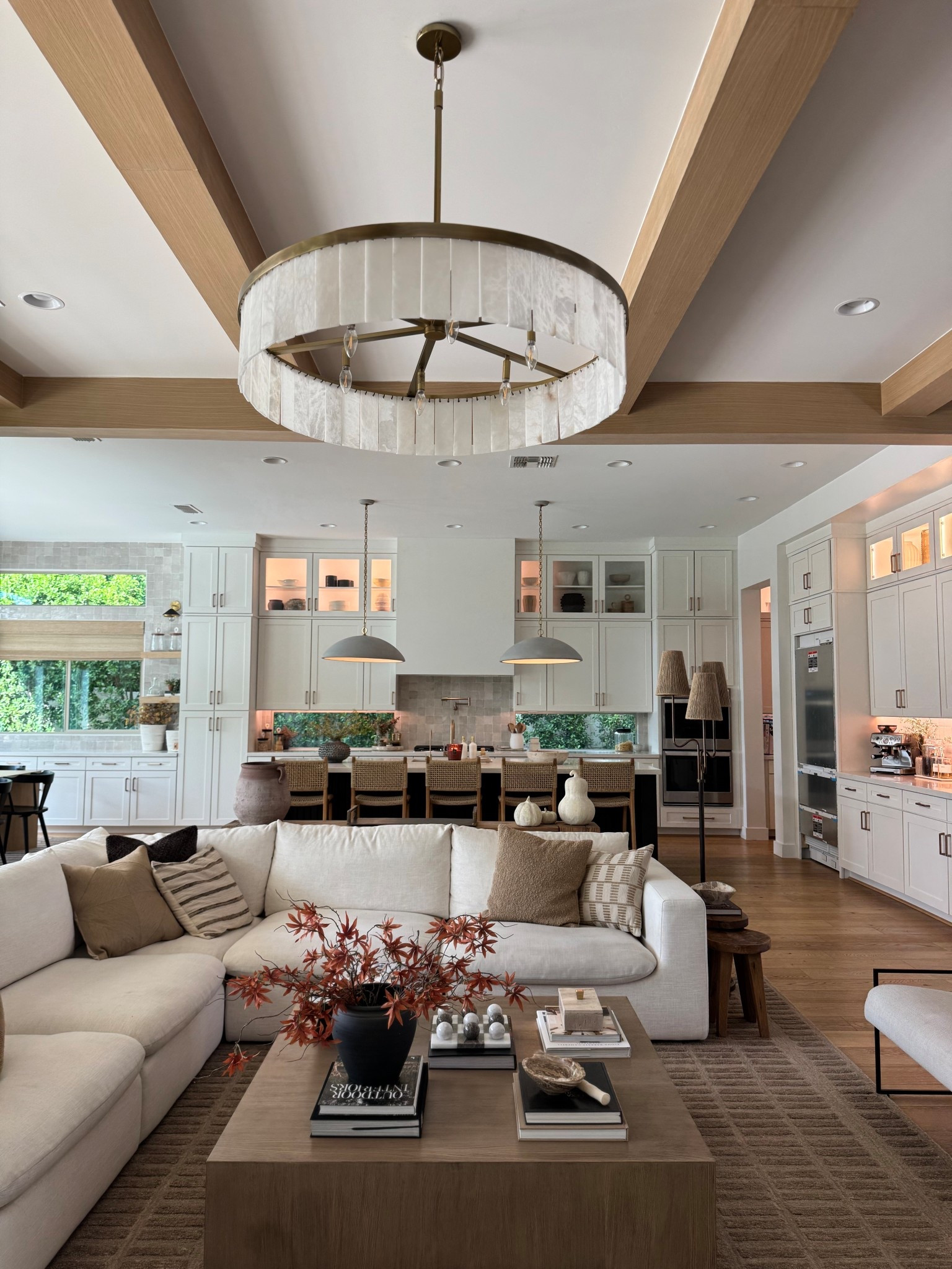 Don’t mind our brand new refrigerator without the panels😆

Wanted to share an updated photo of the space since we’ve added the beams. 

Living room-home inspiration-alabaster chandelier-organic modern-warm tones-unique home decor-L shaped sectional-modern light fixtures-moroccan handmade tile-champagne bronze hardware-modern brown area rug-Oversized area rug 

#LTKHome #LTKFallSale #LTKSeasonal