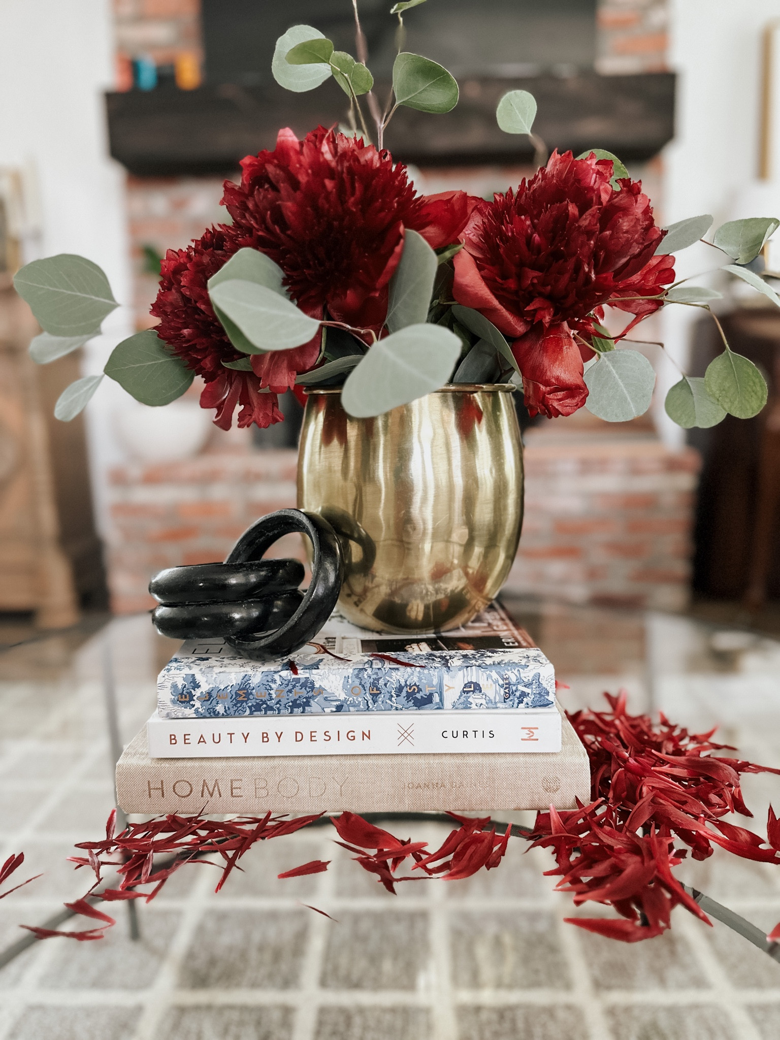Fresh Trader Joe’s flowers in a gold Threshold vase stacked on some of my favorite design books. 

#LTKunder50 #LTKhome #LTKFind