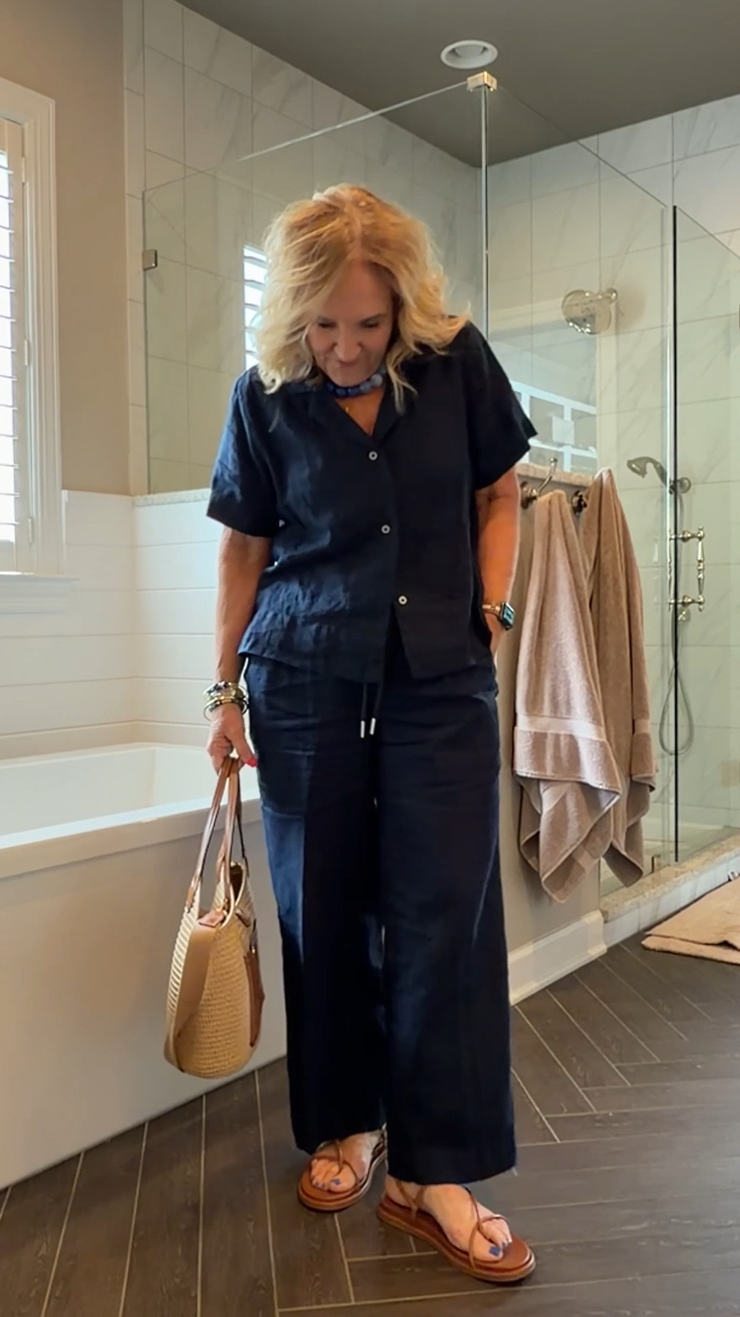 Navy linen pants and matching top. Wearing size medium in both 
Bag is amazing. Great for travel as it packs without getting crunched! 10% off code on the bag NANETTE

#LTKOver40 #LTKootd #LTKTravel