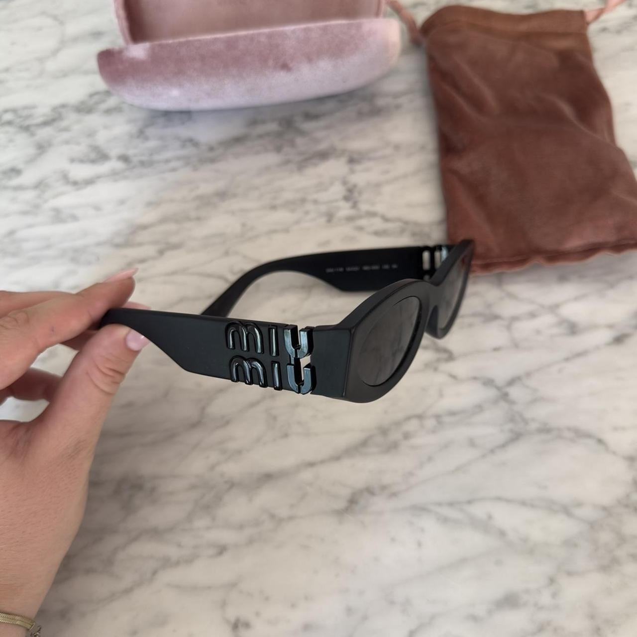 Authentic Miu Miu 11WS black matte sunglasses

Brand... | Depop | Depop AU