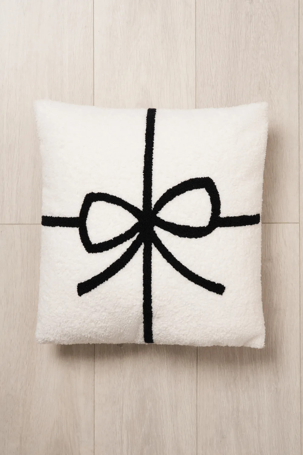 Christmas Present Bow Tufted Cushion | Debenhams UK
