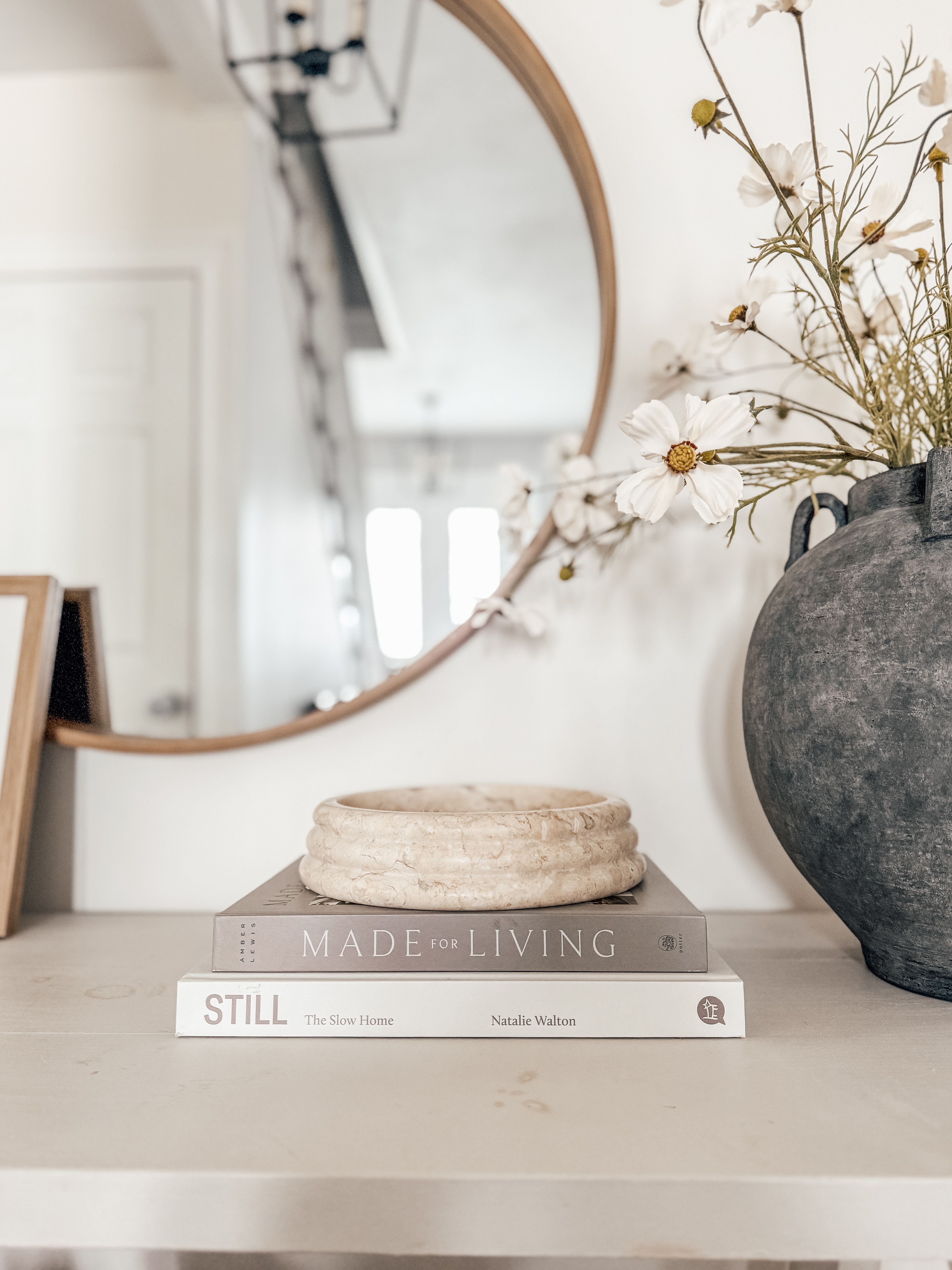 A light + airy entry table moment for summer 🌼☀️ I styled this space with soft neutrals, natural textures, and just a hint of seasonal charm. Think: breezy florals, timeless coffee table books, and organic pottery for that effortless, lived-in look. Everything’s linked for you to shop and recreate this calm, curated vibe in your own home.

✨ Tap to shop my entryway decor
🏡 Perfect for summer styling
📚 Coffee table books: Made for Living + Still
🌿 Vase, faux florals, decor bowl & more all linked!

#LTKhome #entrywaydecor #summerdecor #neutralhome #organicmodern #coffeetablebooks #fauxflowers #homedecorideas #styledsurfaces 

 

#LTKSeasonal #LTKHome #LTKFamily
