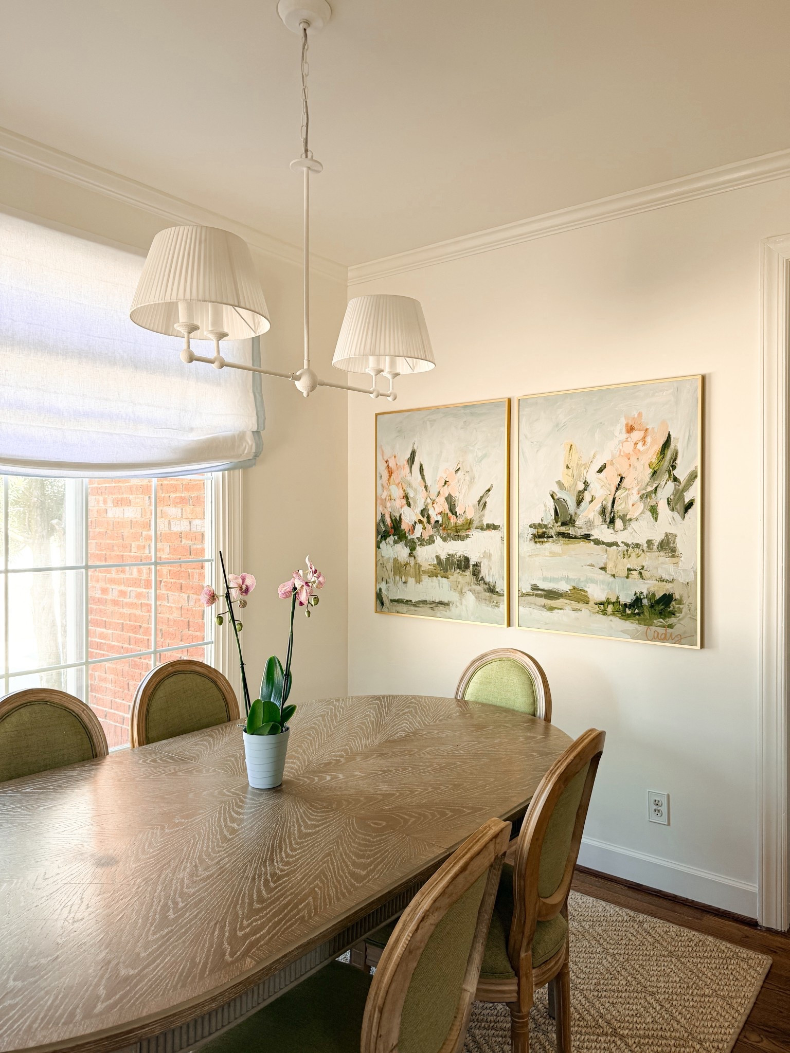 Easy and elevated breakfast nook with plenty of budget finds! Amazon rug, chairs, shades, & chandelier. Art linked 30x40 size shown here. Oval table from Gabby  

#LTKHome
