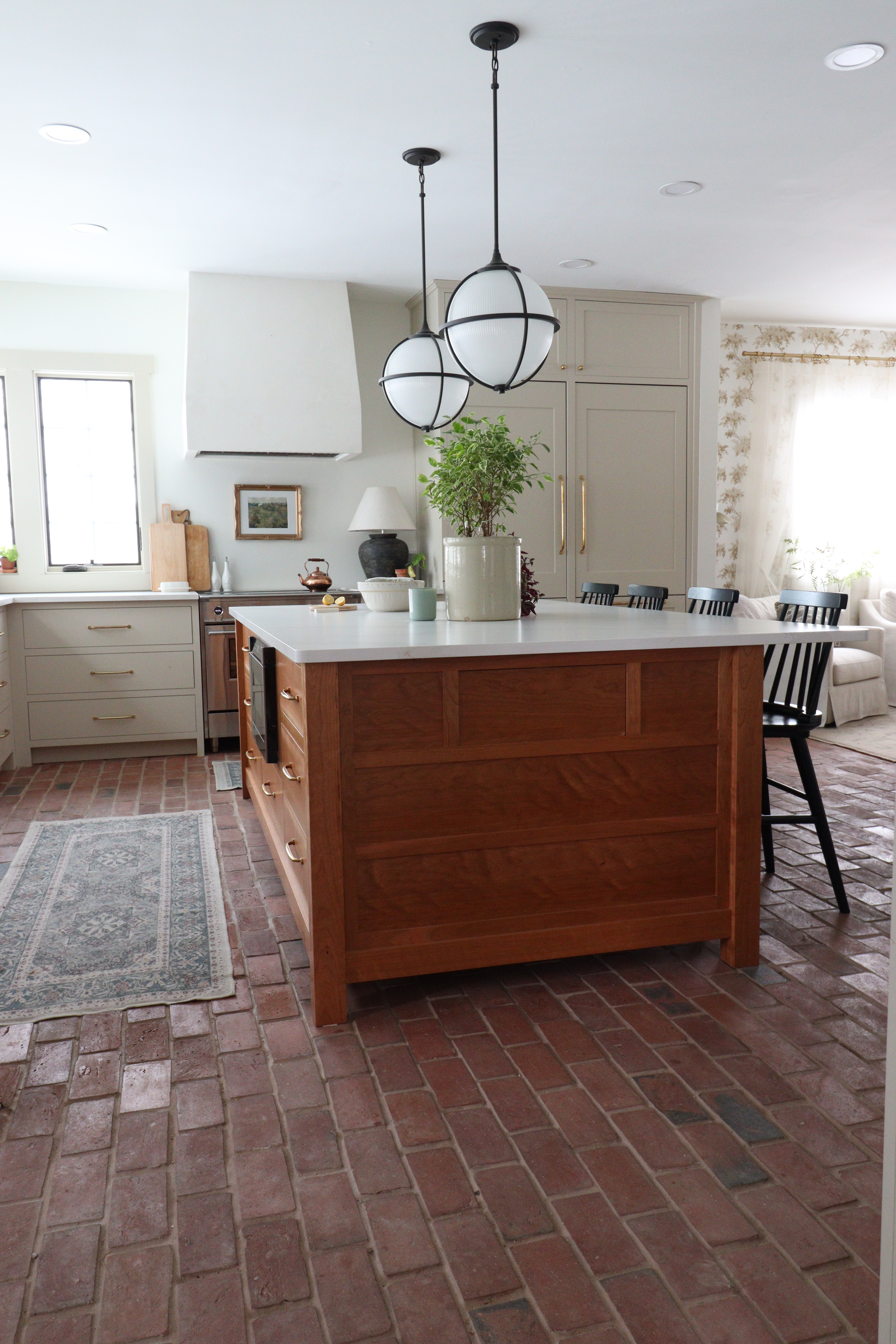 Brick floors add so much warmth and character and make the space feel lived-in and timeless. I linked similar lighting, decor, and kitchen styling pieces to help recreate this cozy, classic kitchen look. 

 #LTKHome