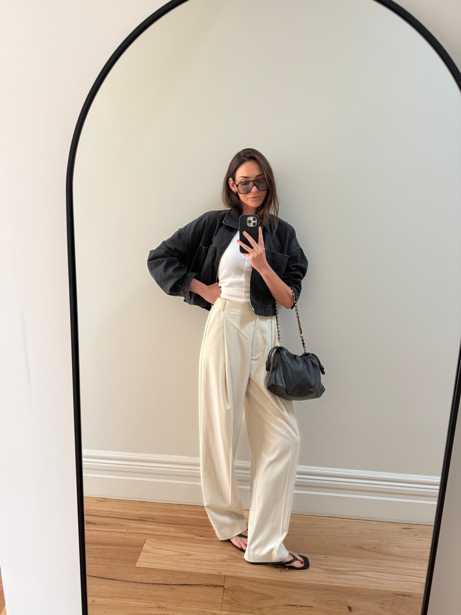 OOTD 

Black denim jacket 
White singlet 
Cream trousers 
Black sandals 
Leather bag with gold detailing 
Oversized sunglasses 

#LTKSeasonal #LTKootd